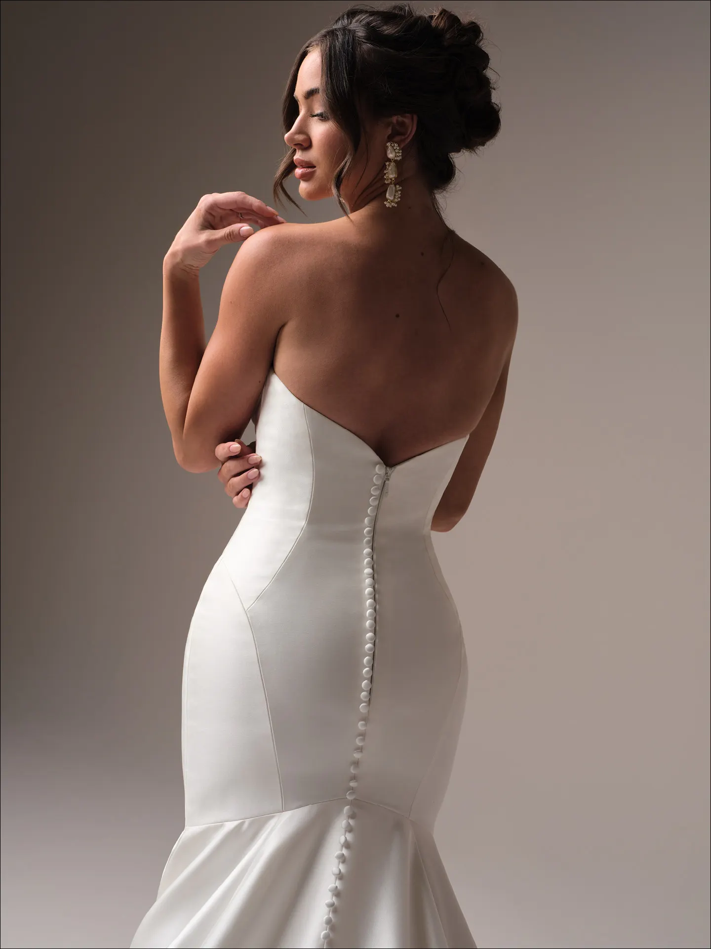 Maggie Sottero Odette fit and flare wedding dress side angle with sculpted silhouette