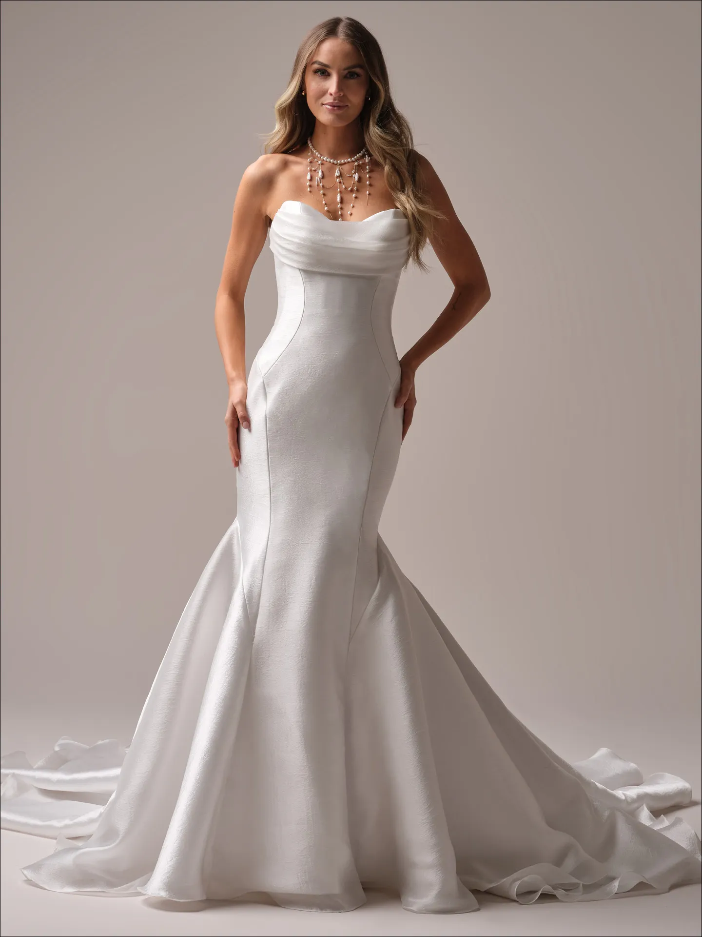 Maggie Sottero Odette Marie fit and flare wedding dress side view with fitted silhouette