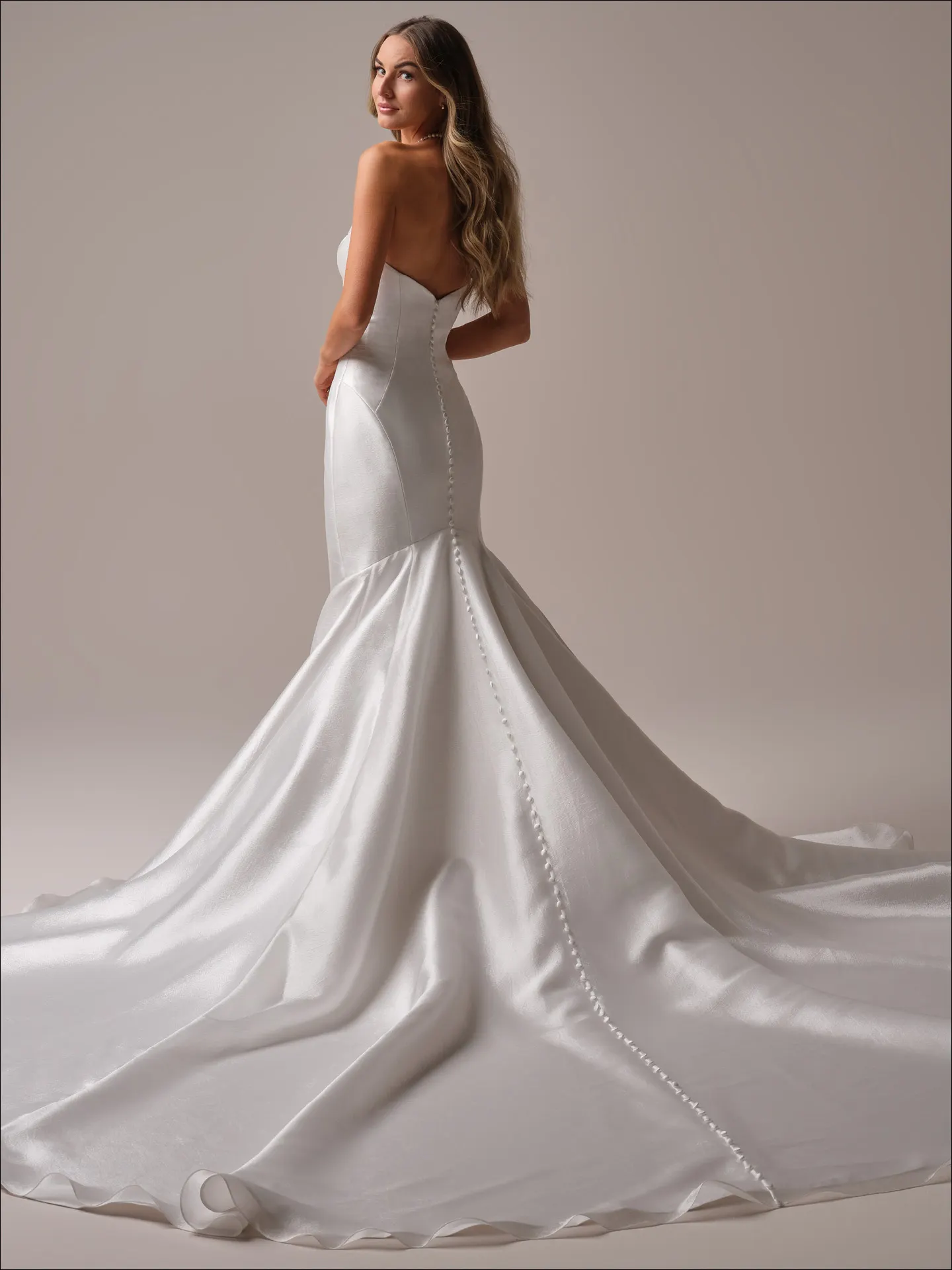 Maggie Sottero Odette Marie fit and flare wedding dress back view with extended train