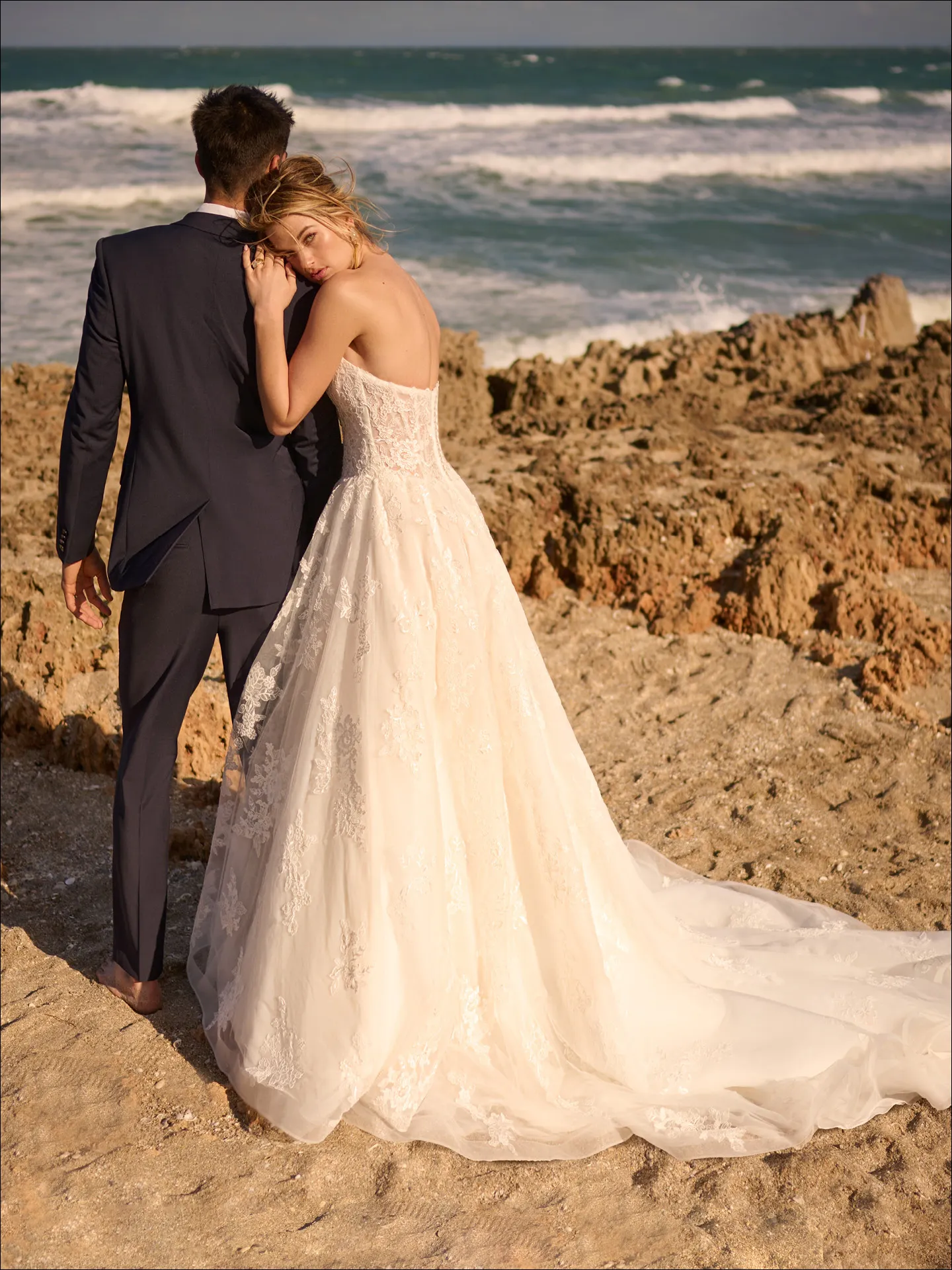 Maggie Sottero Prescott ballgown wedding dress side angle with layered tulle skirt