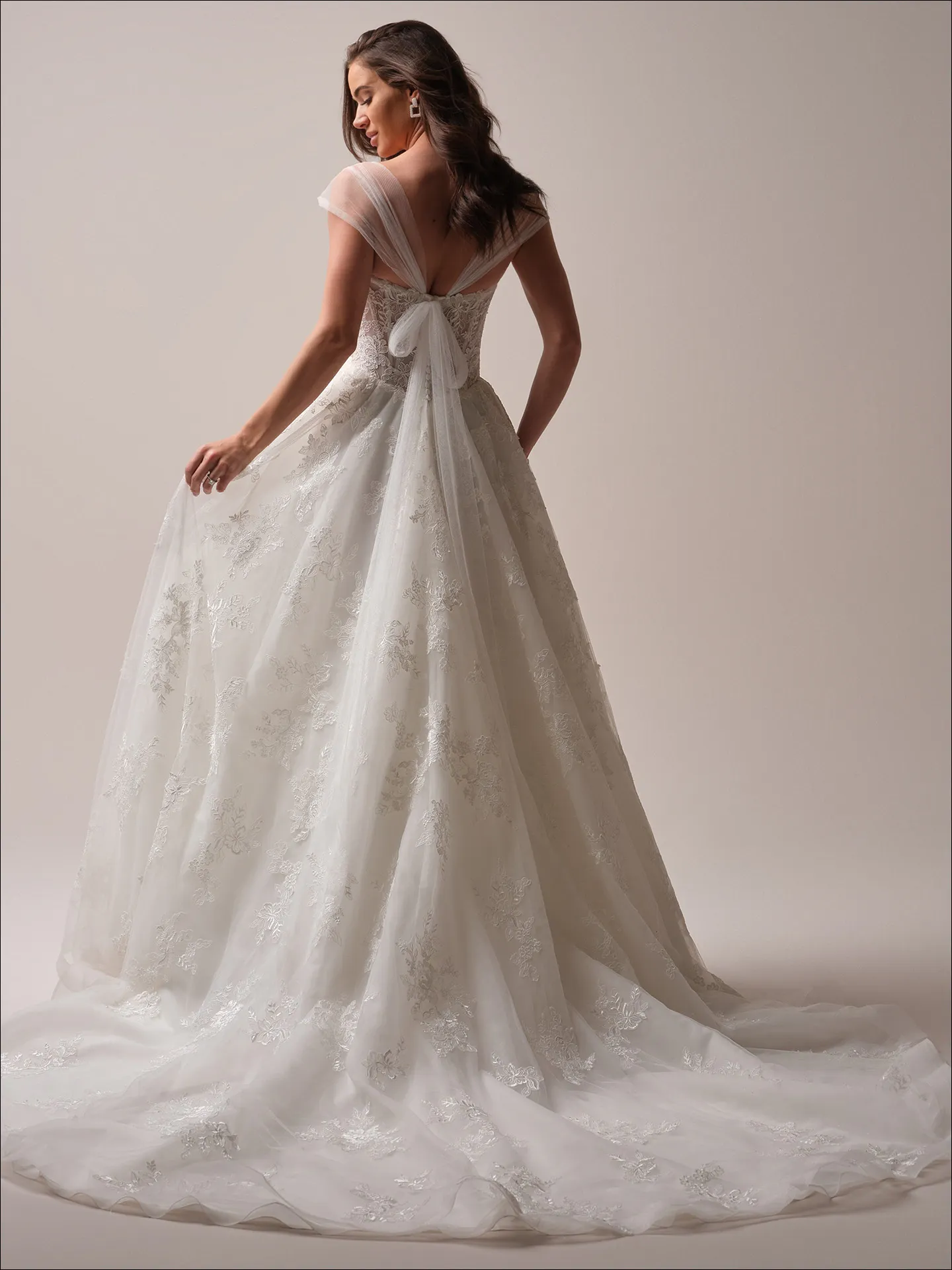 Maggie Sottero Prescott ballgown wedding dress back view with wide skirt train