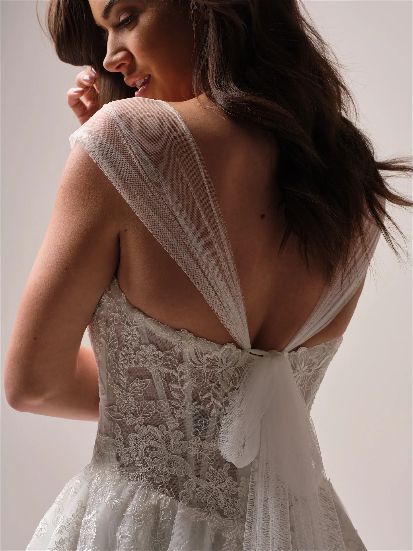 Maggie Sottero Prescott ballgown wedding dress side angle with flowing skirt