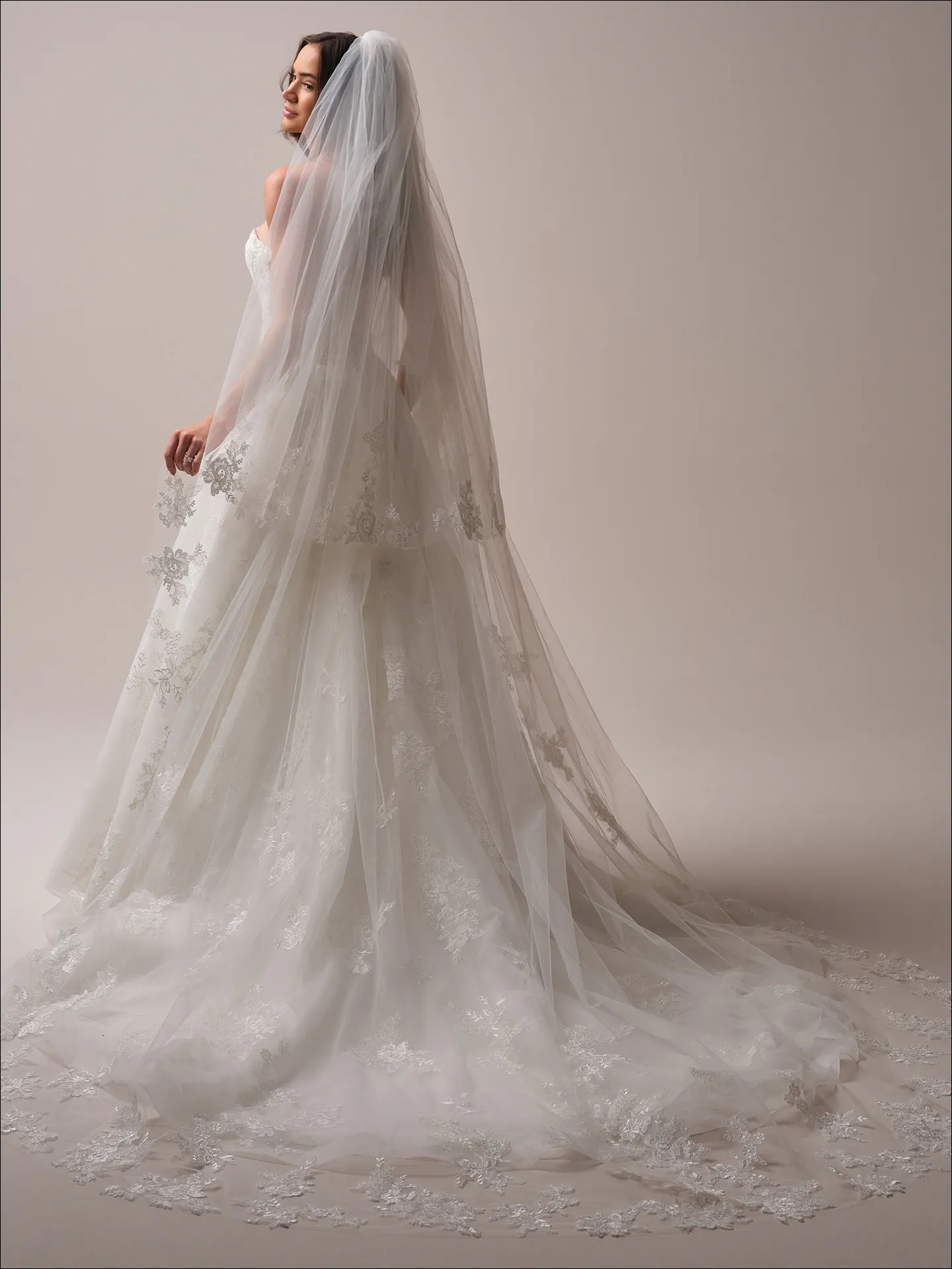 Maggie Sottero Prescott ballgown wedding dress side angle with full skirt and train