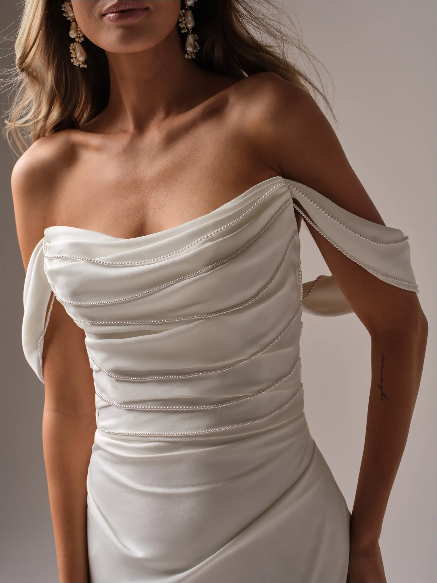 Maggie Sottero Rhoda sheath wedding dress side angle with lace detail