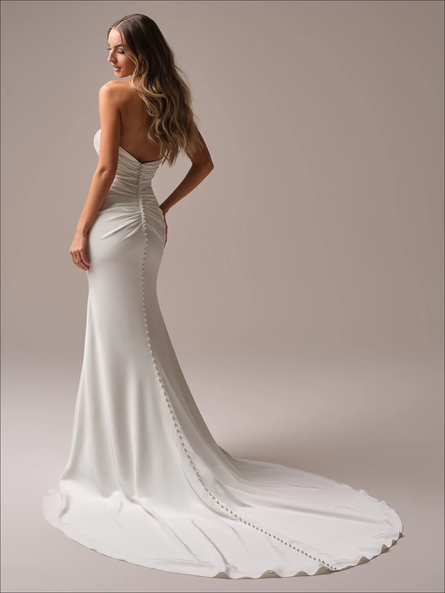Maggie Sottero Rhoda sheath wedding dress back angle with fitted silhouette
