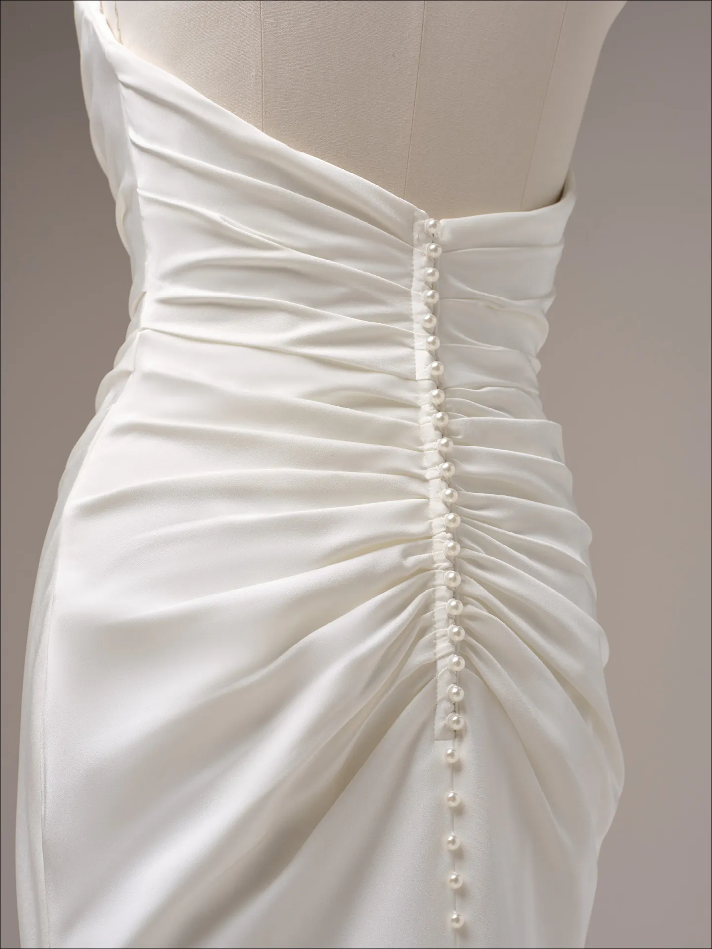 Maggie Sottero Rhoda sheath wedding dress side angle with sleek silhouette