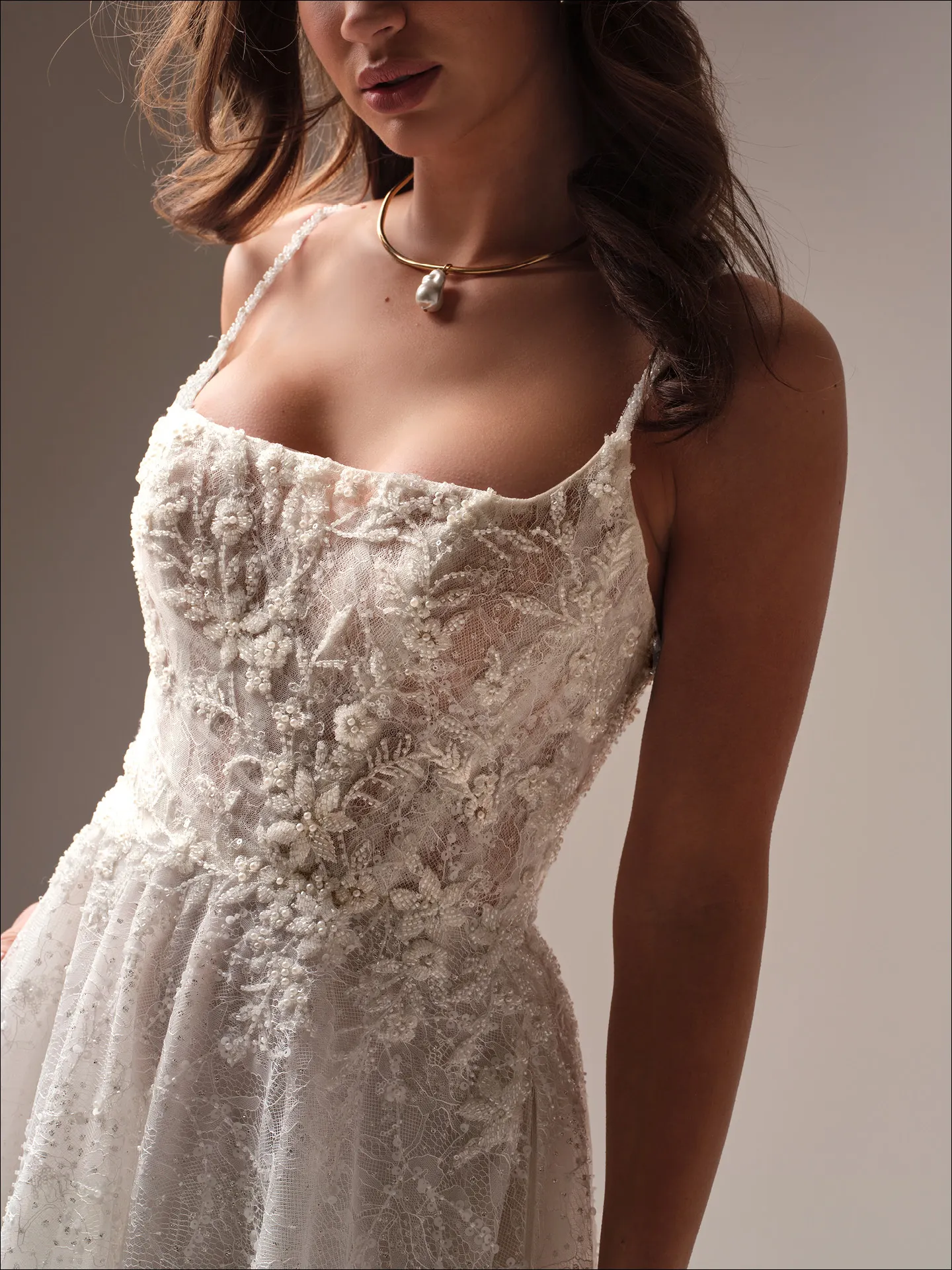 Maggie Sottero Salvadora A line wedding dress side view with flowing tulle skirt