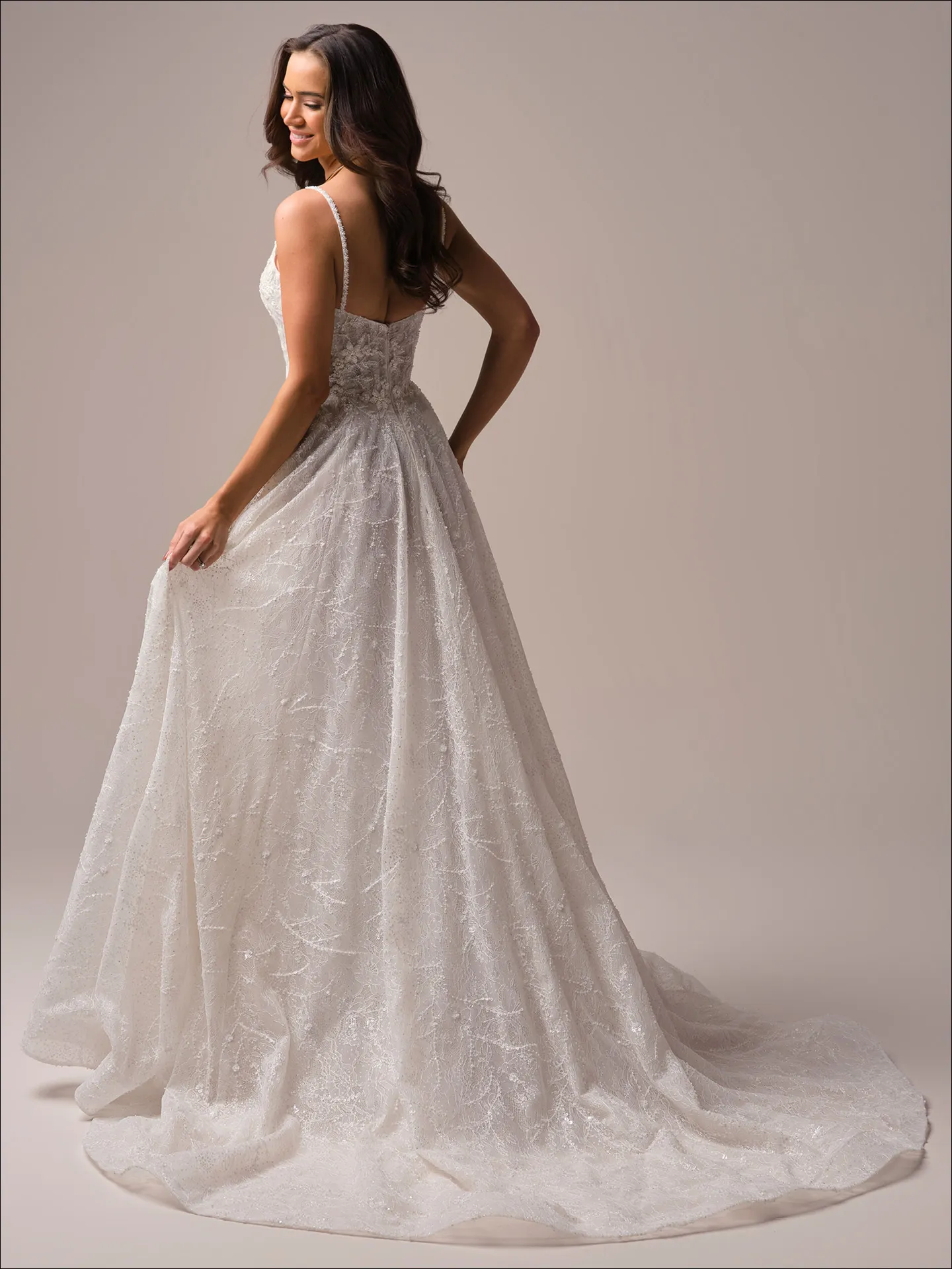 Maggie Sottero Salvadora A line wedding dress side angle with fitted bodice