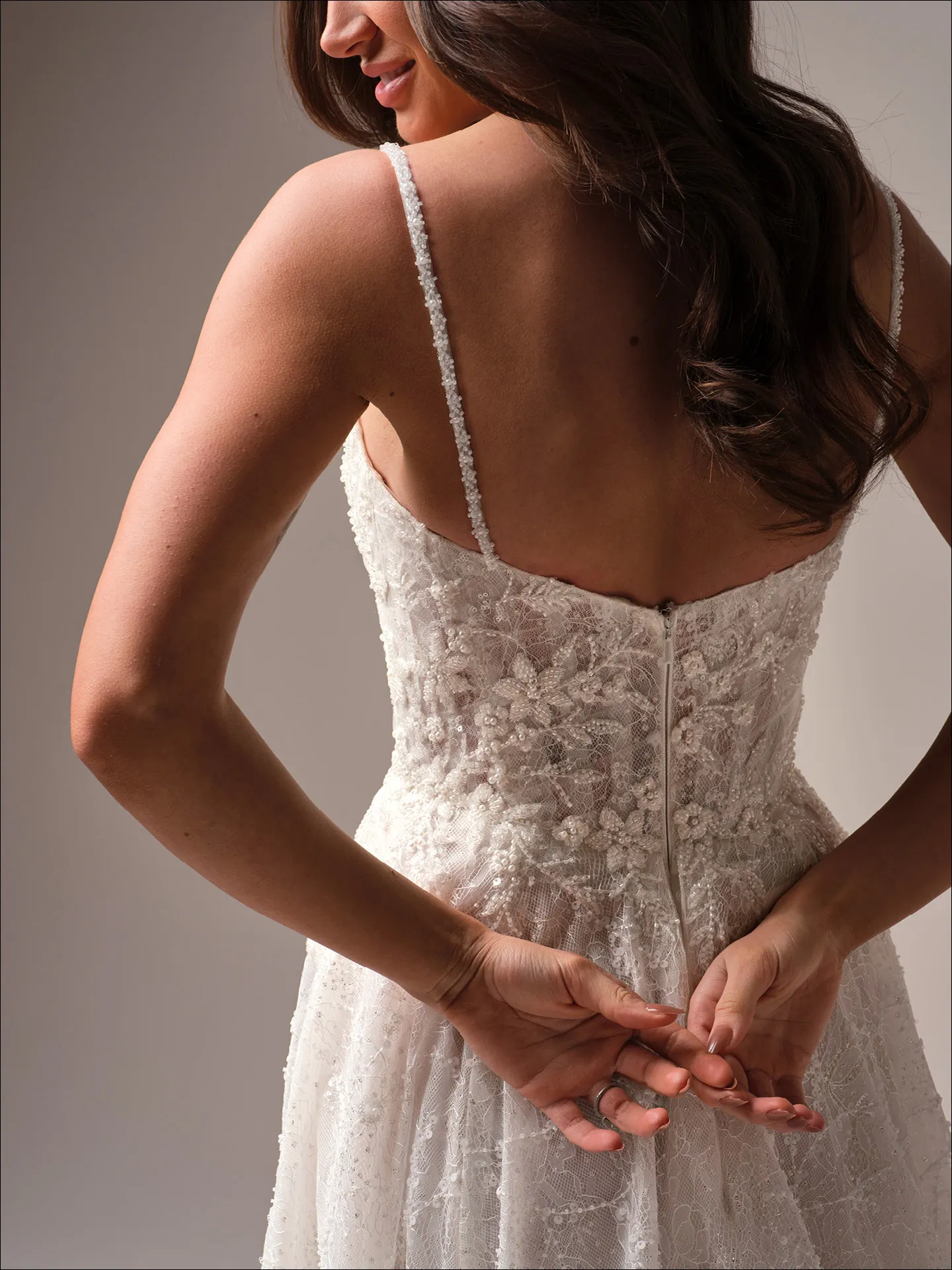 Maggie Sottero Salvadora A line wedding dress back angle with extended train