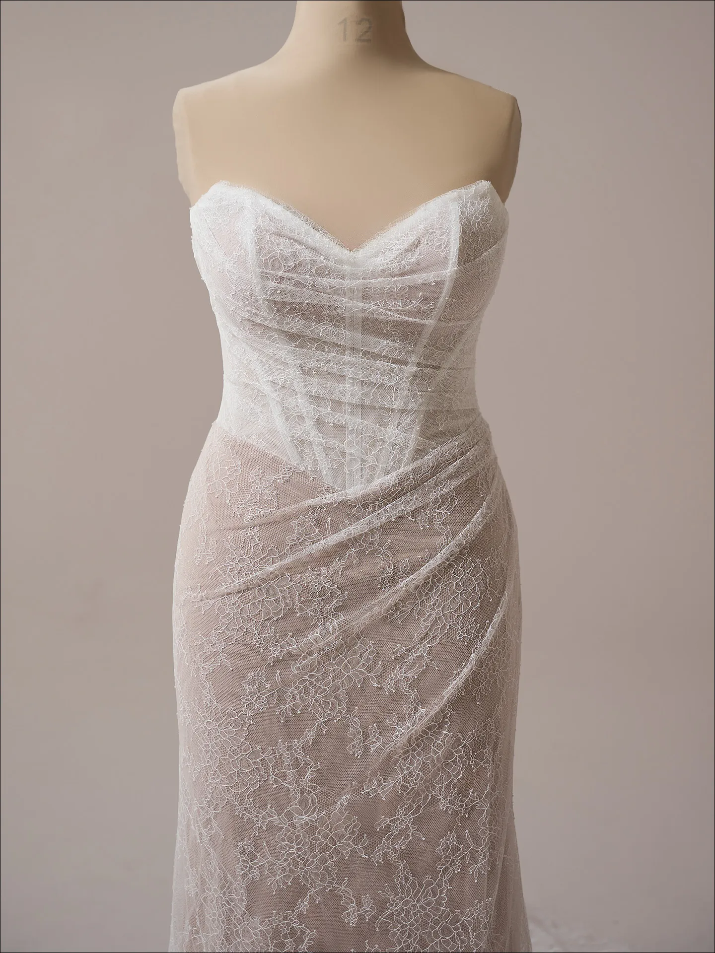 Maggie Sottero Sasha sheath wedding dress front view in soft ivory fitted lace