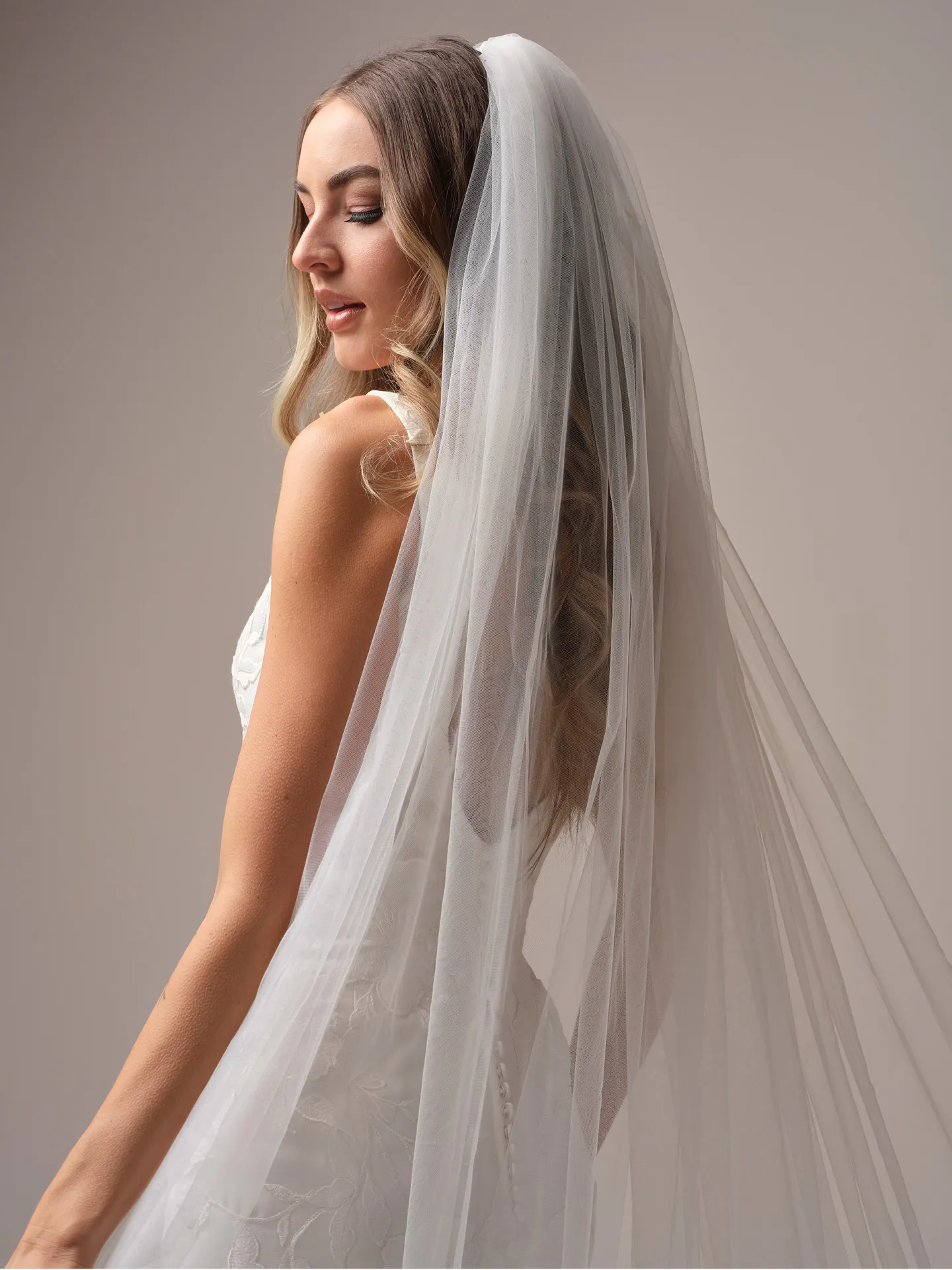 Maggie Sottero Sheridan Lane fit and flare wedding dress side angle with sculpted silhouette
