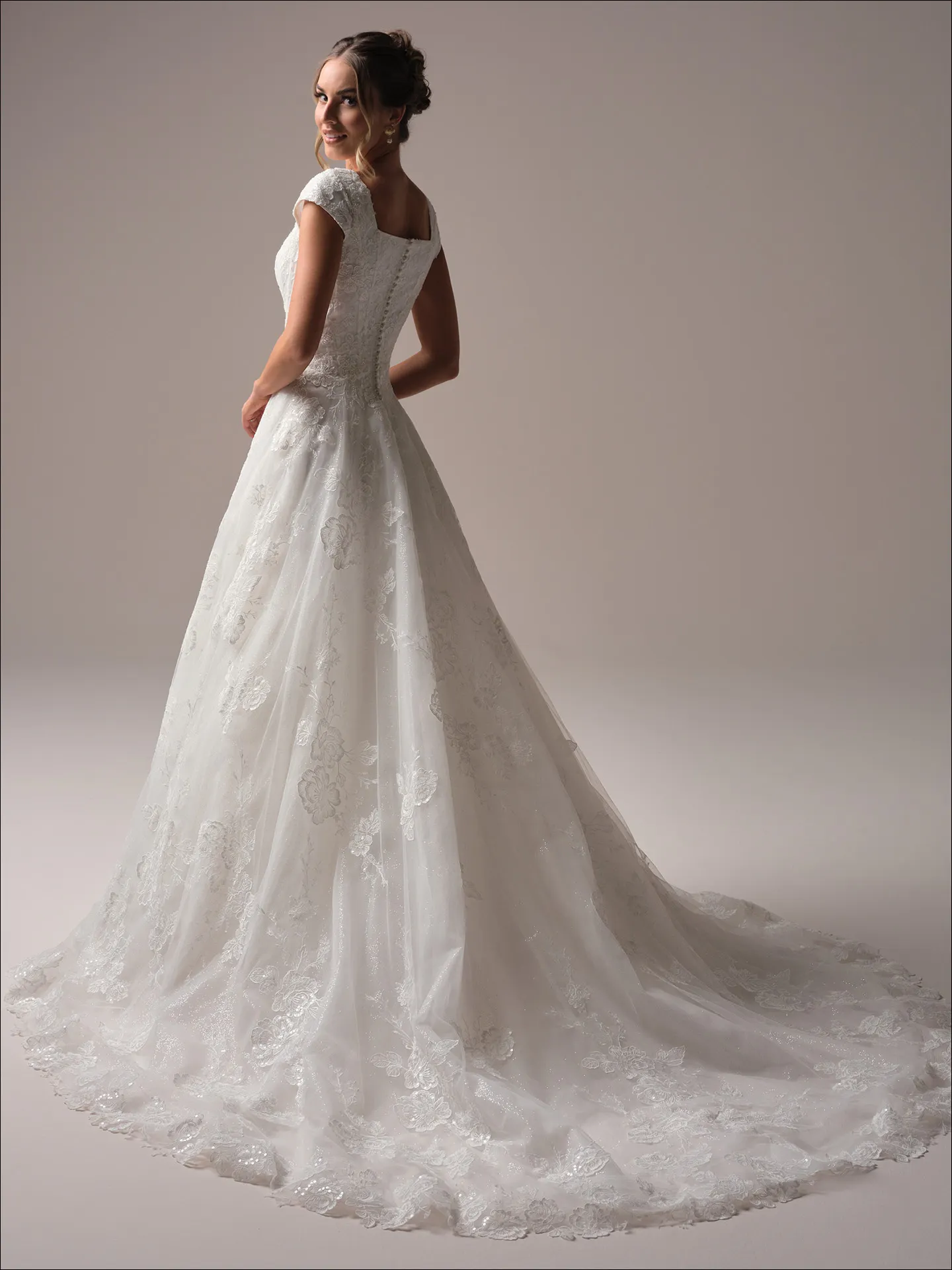 Maggie Sottero Skylar Leigh ballgown wedding dress back view with long flowing train
