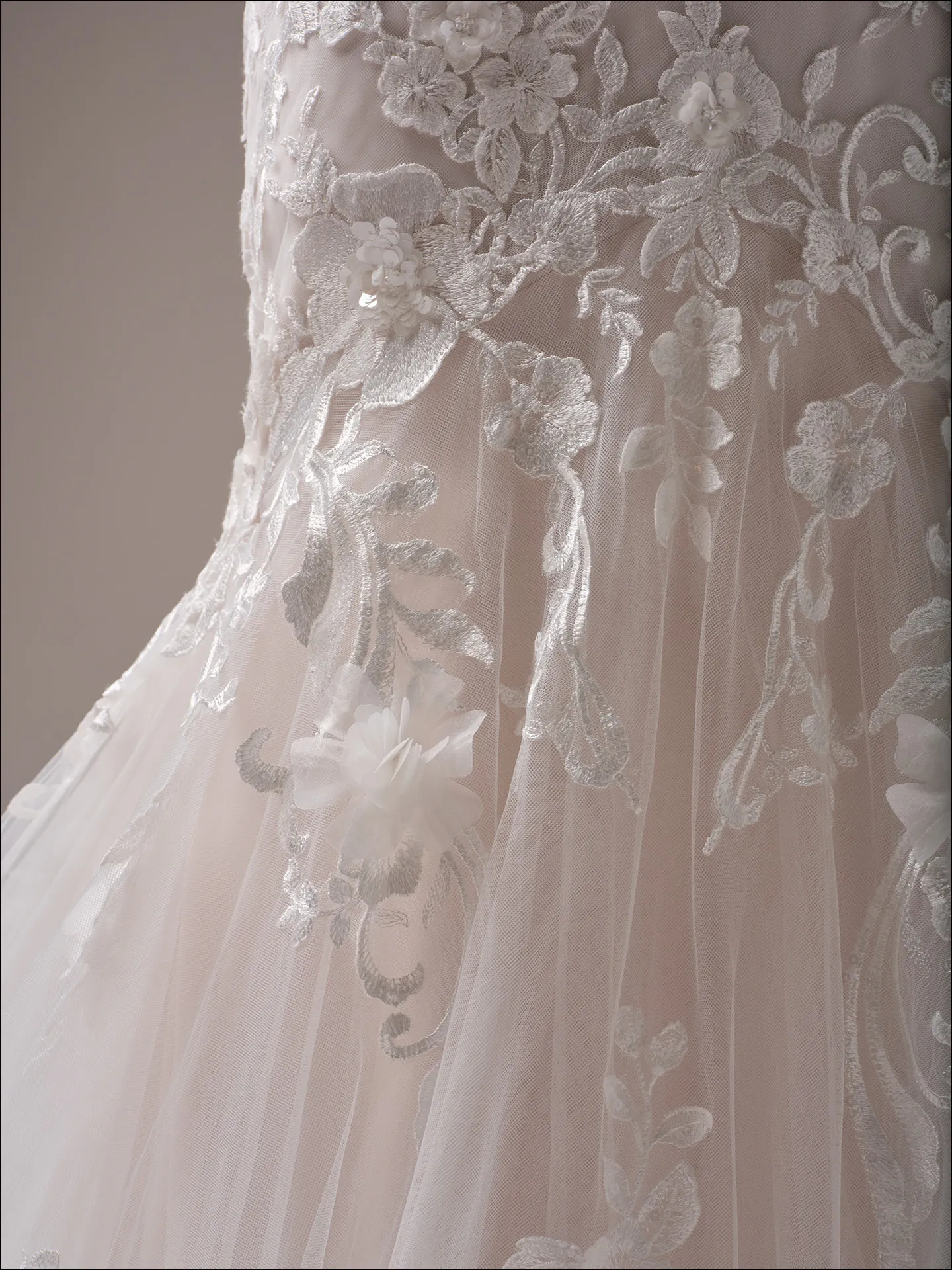 Maggie Sottero Sonoma fit and flare wedding dress side angle with fitted skirt