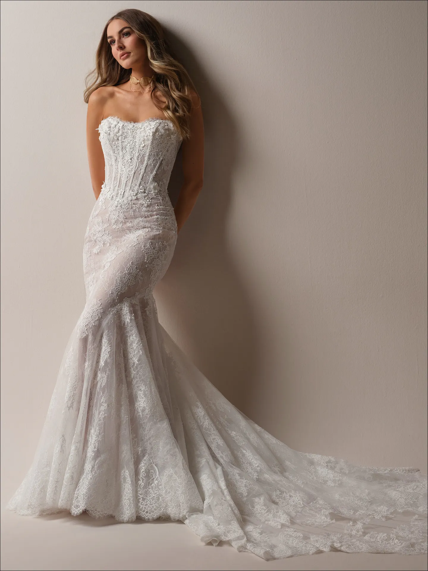 Maggie Sottero Takera fit and flare wedding dress side view with fitted silhouette