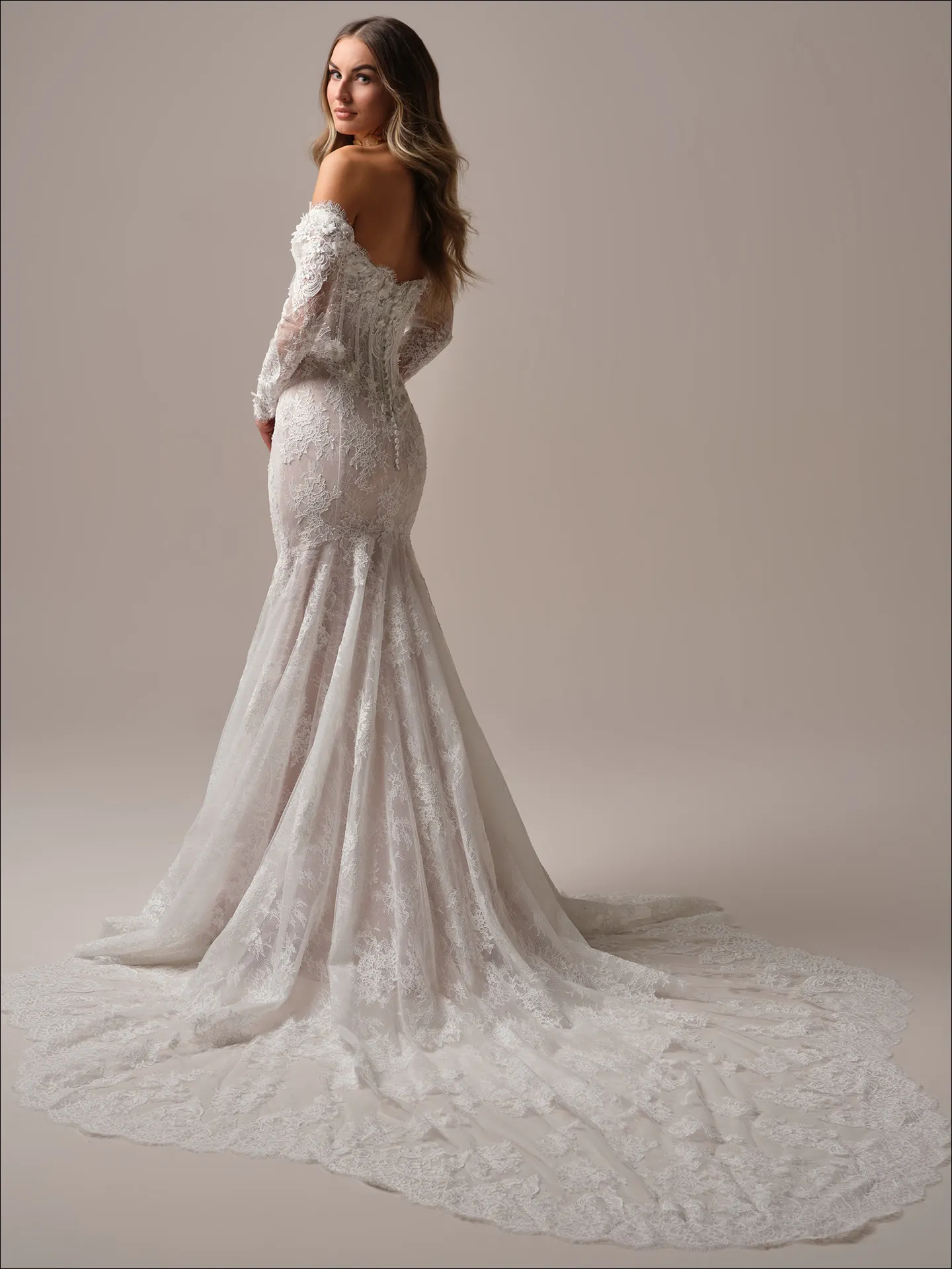 Maggie Sottero Takera fit and flare wedding dress side profile with lace detail