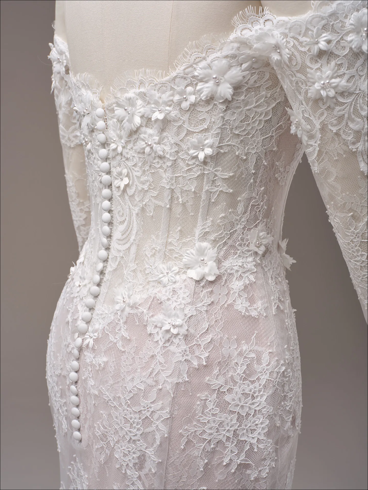 Maggie Sottero Takera fit and flare wedding dress back angle with extended train