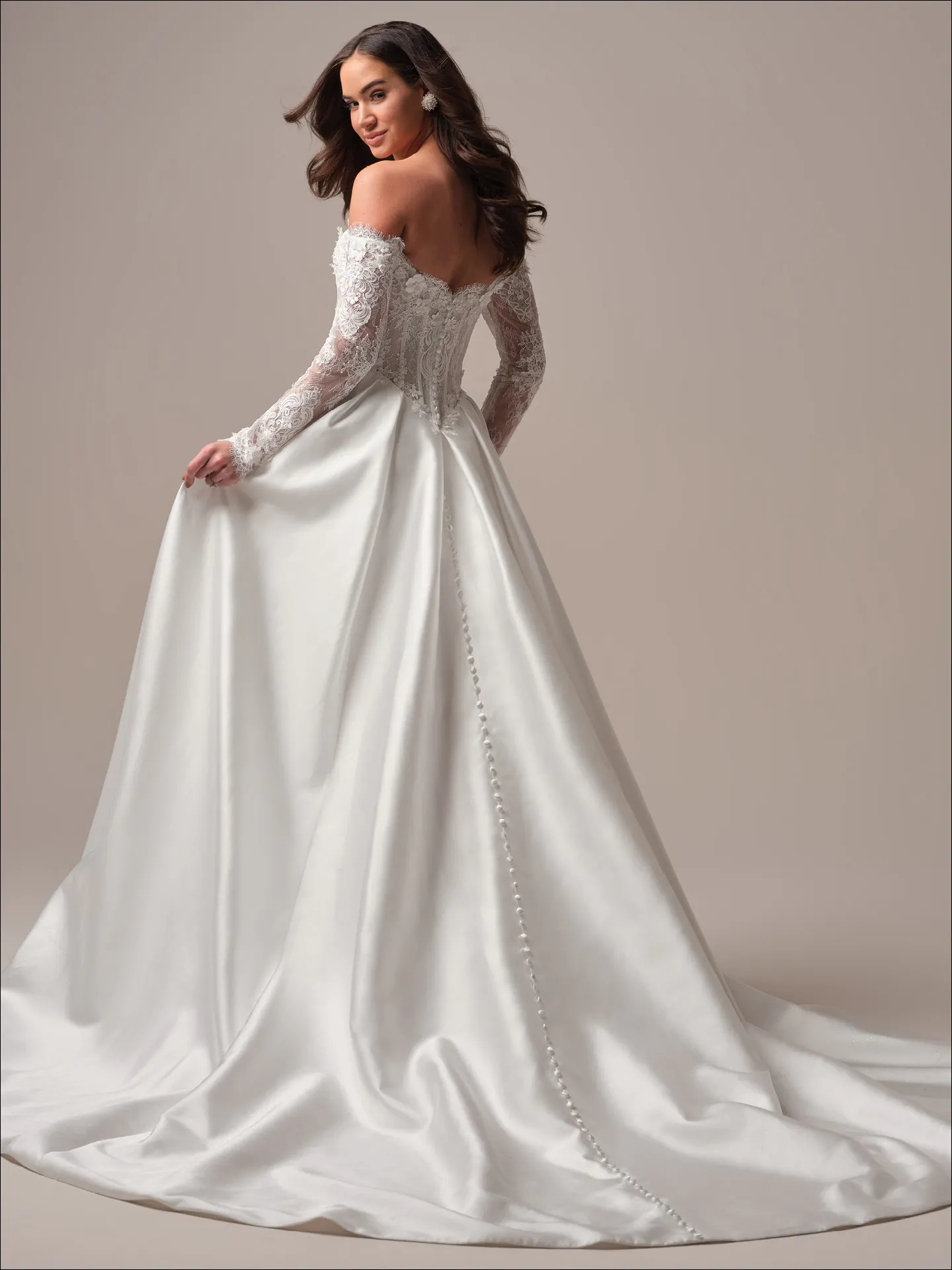 Maggie Sottero Takera Lane A line wedding dress side angle with fitted bodice