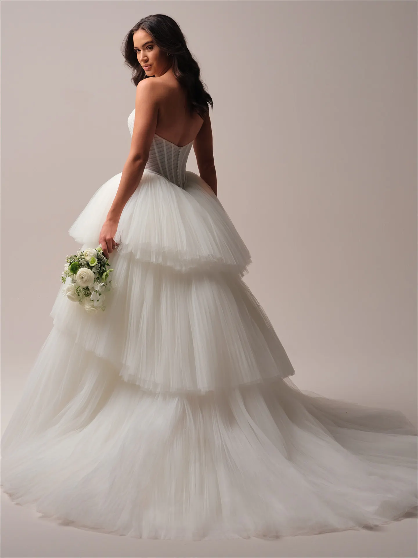 Maggie Sottero Yurianna ballgown wedding dress back angle with flowing train