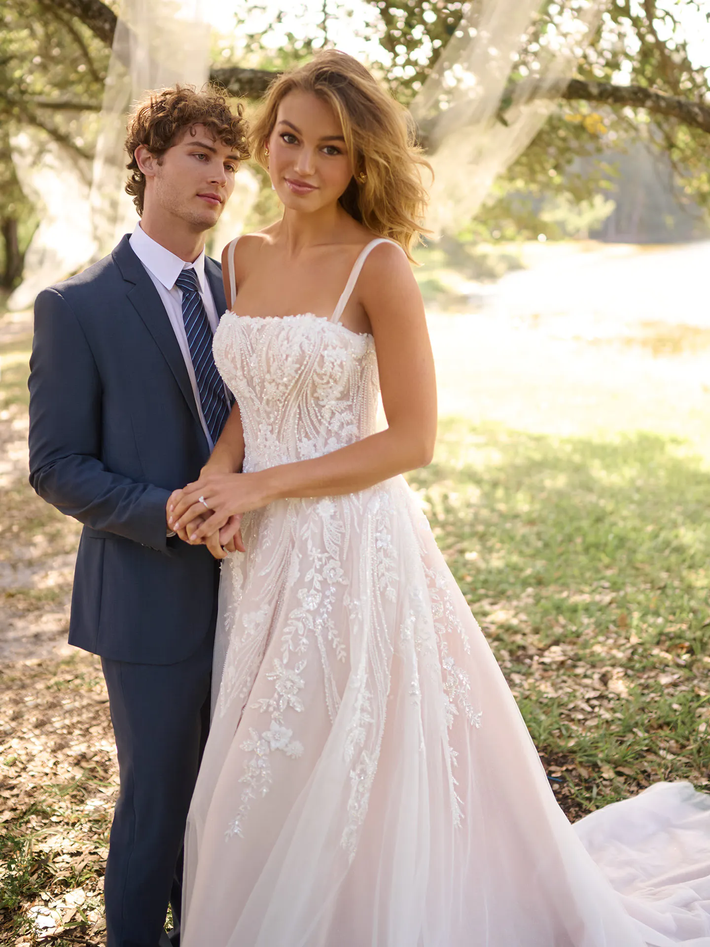 Rebecca Ingram Angie front view lace A-line gown outdoors