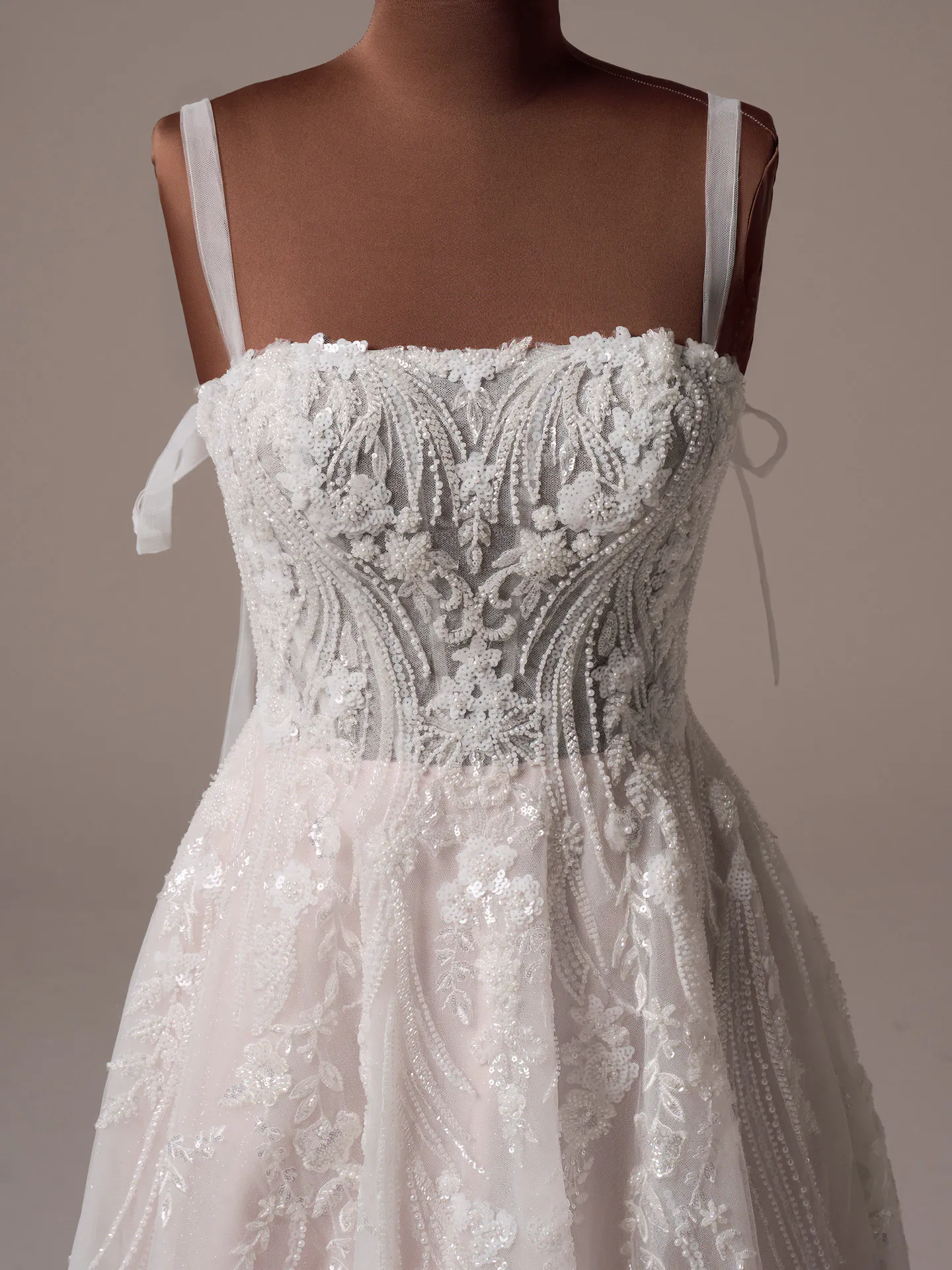 Rebecca Ingram Angie front view beaded A-line gown with lace details