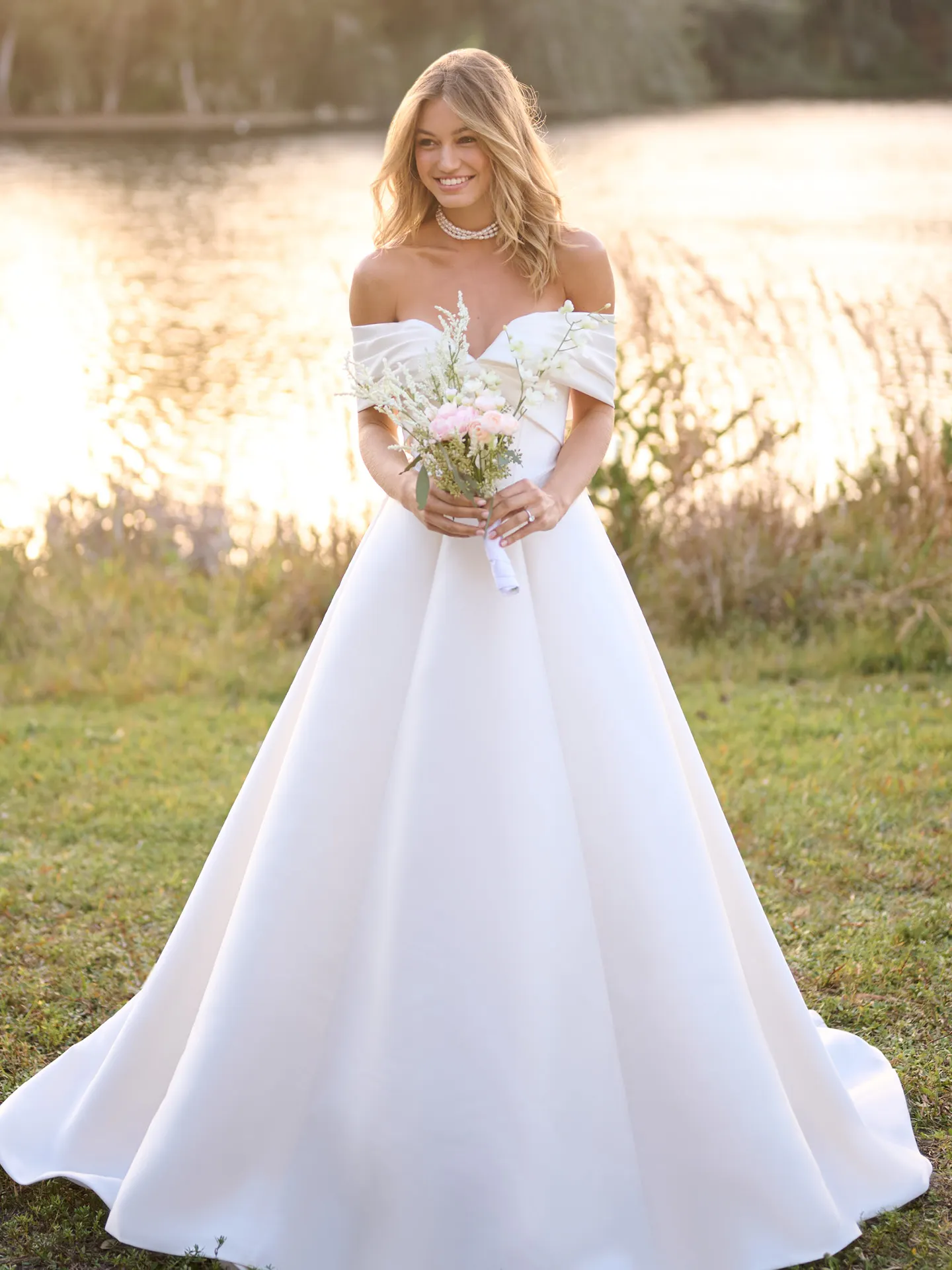Rebecca Ingram Brooke front view A-line wedding dress by a lake