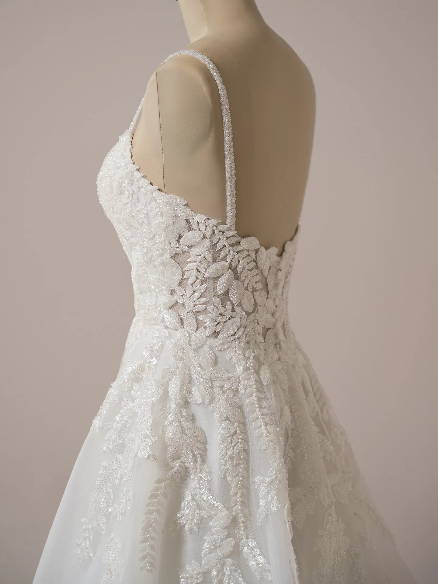 Rebecca Ingram Carmen side view, lace detail, spaghetti straps, A-line wedding gown.