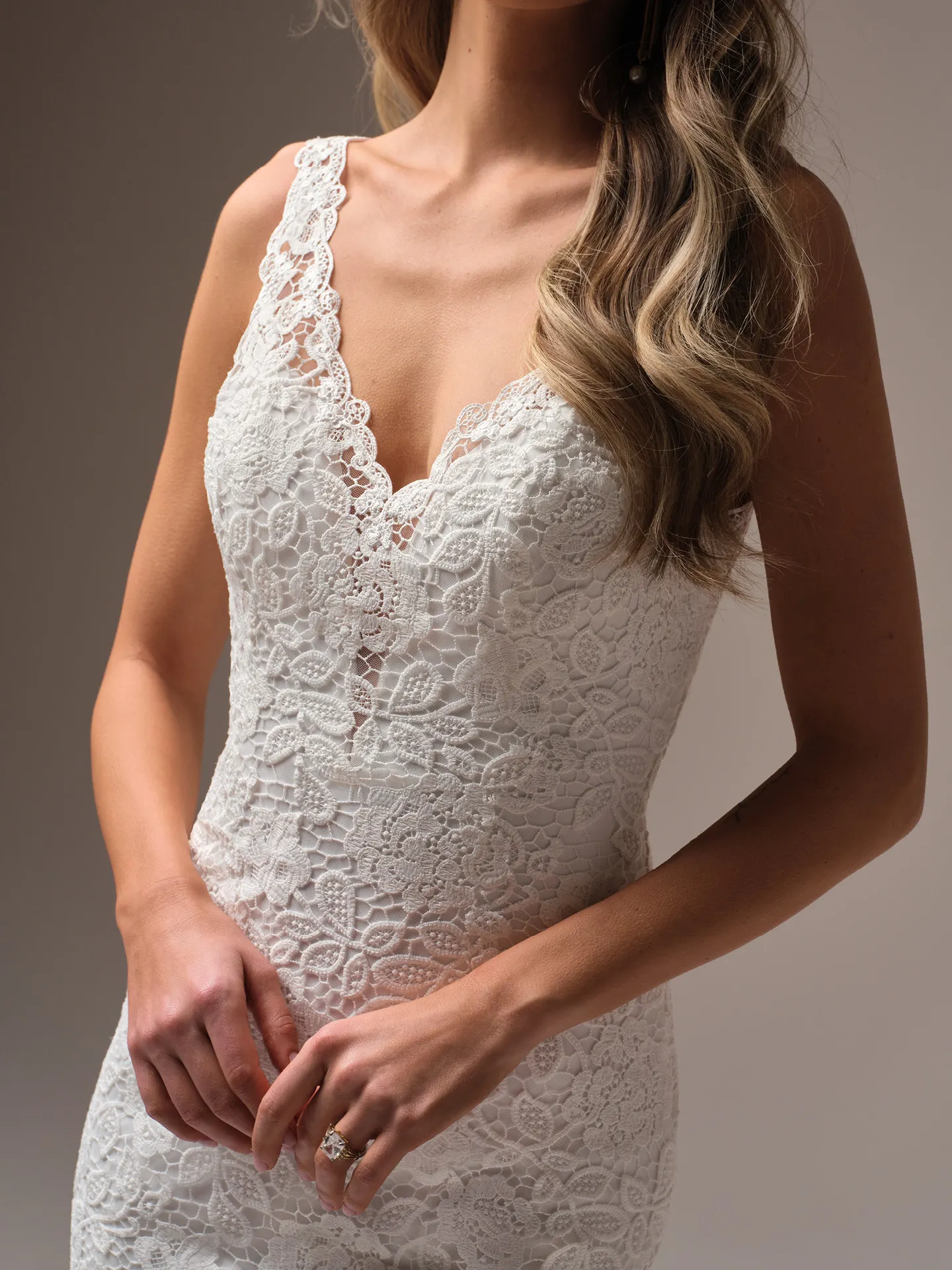 Rebecca Ingram Dayna front view showing lace details and V-neck design.