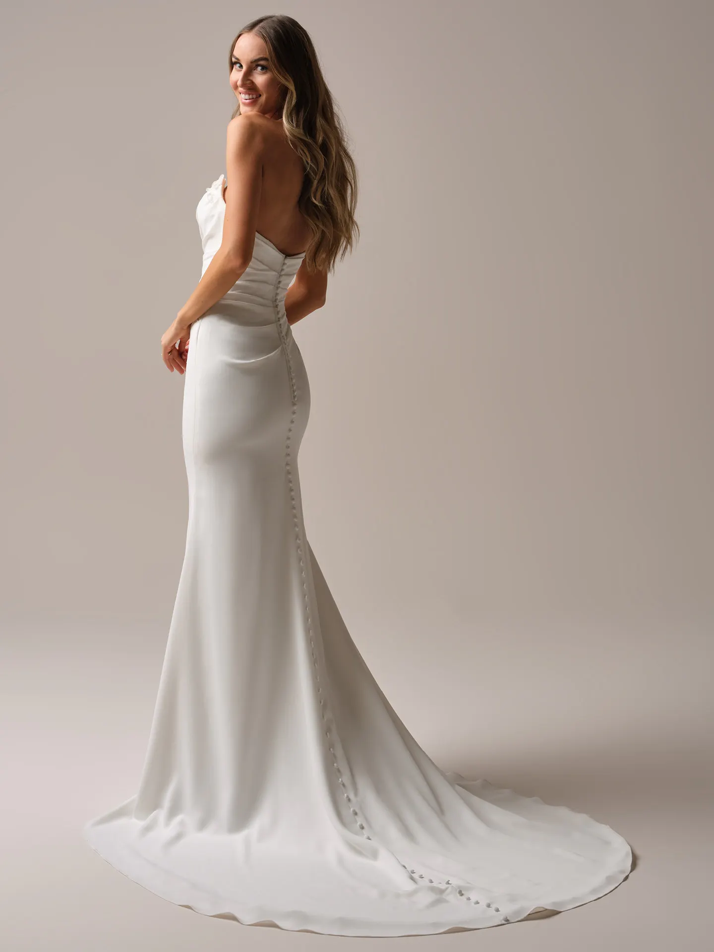 Rebecca Ingram Fantasia back view mermaid bridal dress with buttons and train.