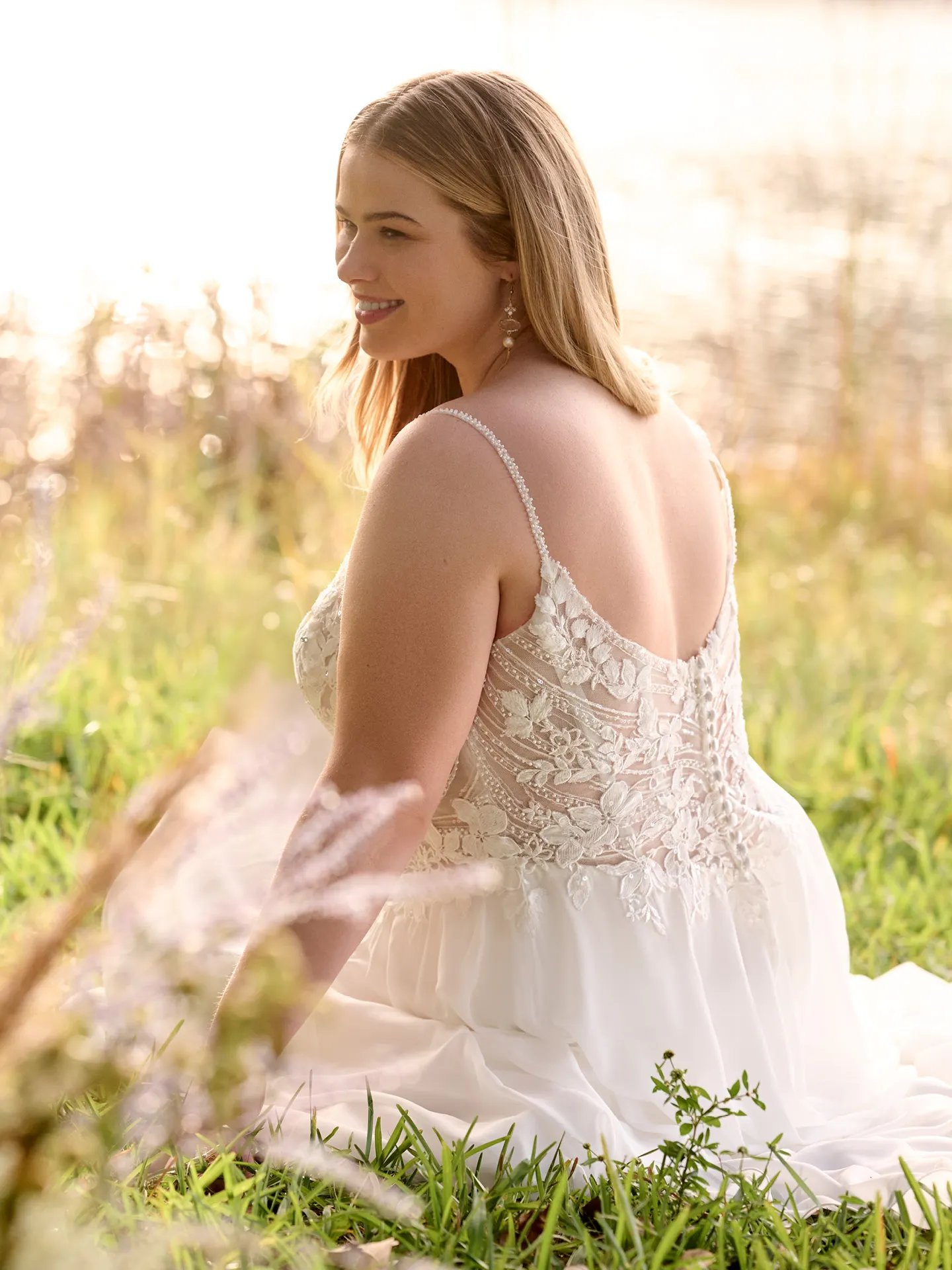 Rebecca Ingram Finley back view sitting in grass