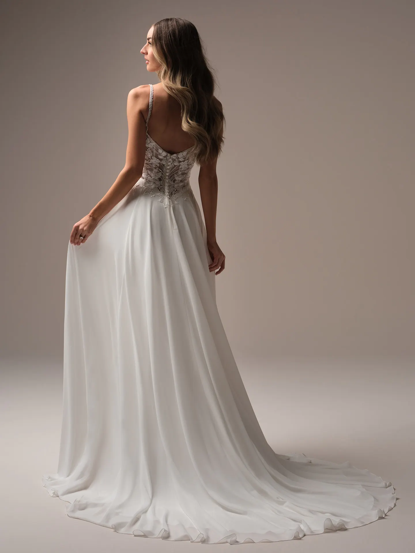 Rebecca Ingram Finley back view A-line bridal gown with plunge neckline flowing skirt