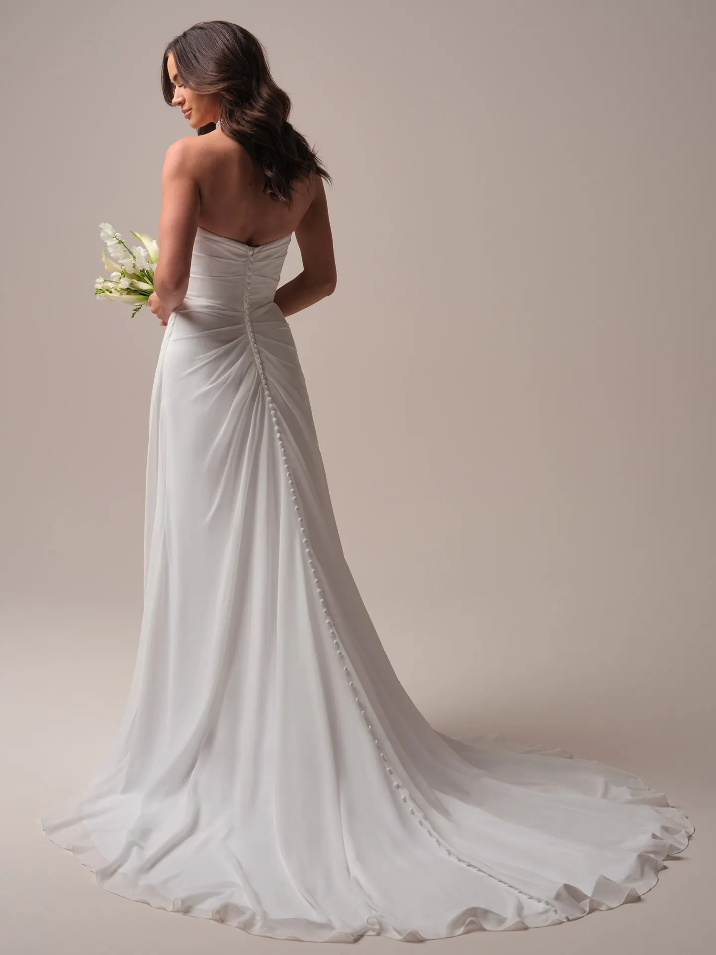 Rebecca Ingram Francesca back view; chiffon sheath wedding dress with button detail.