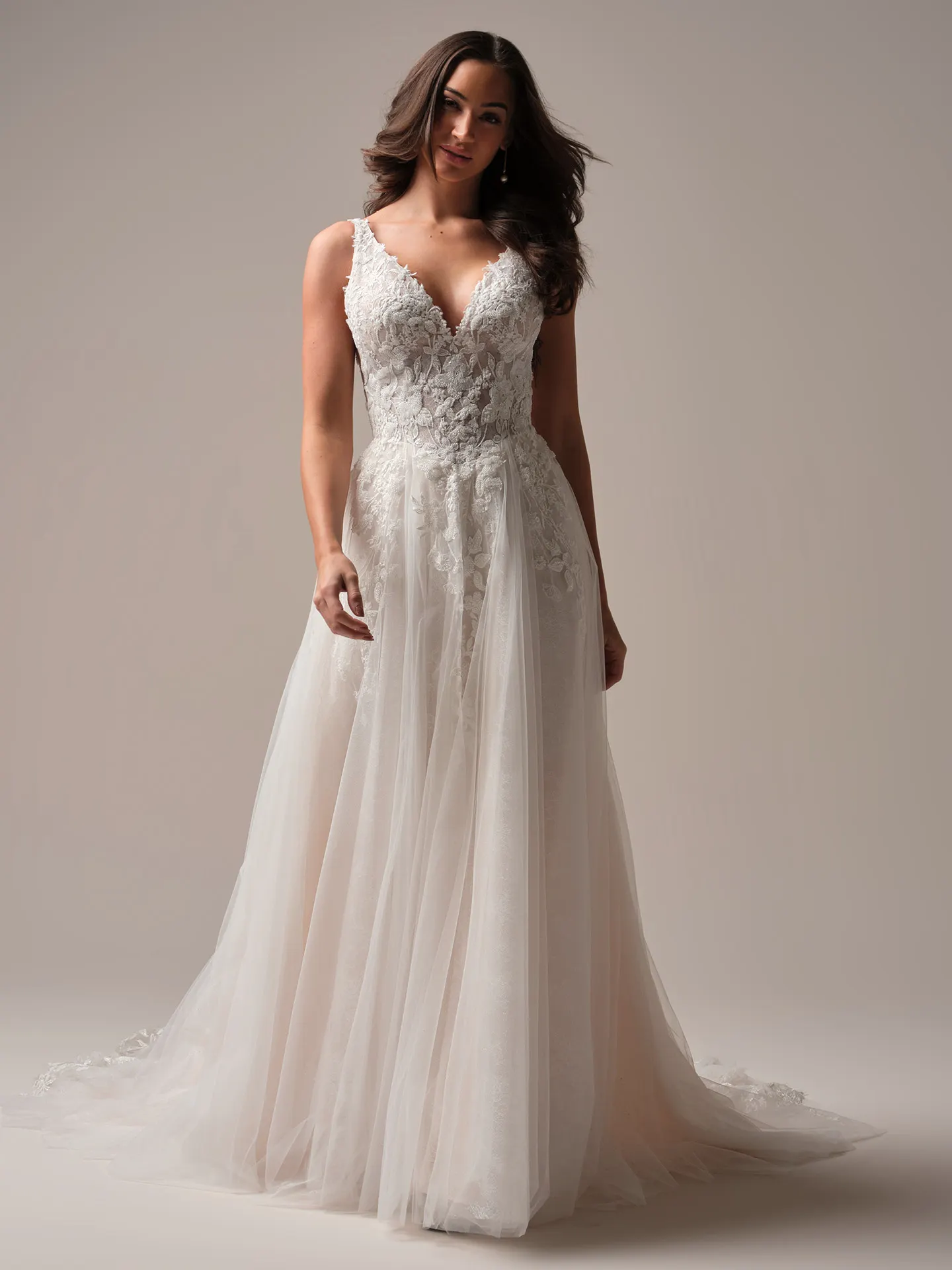 Rebecca Ingram Honor front view A-line gown with beaded V-neck detailing.