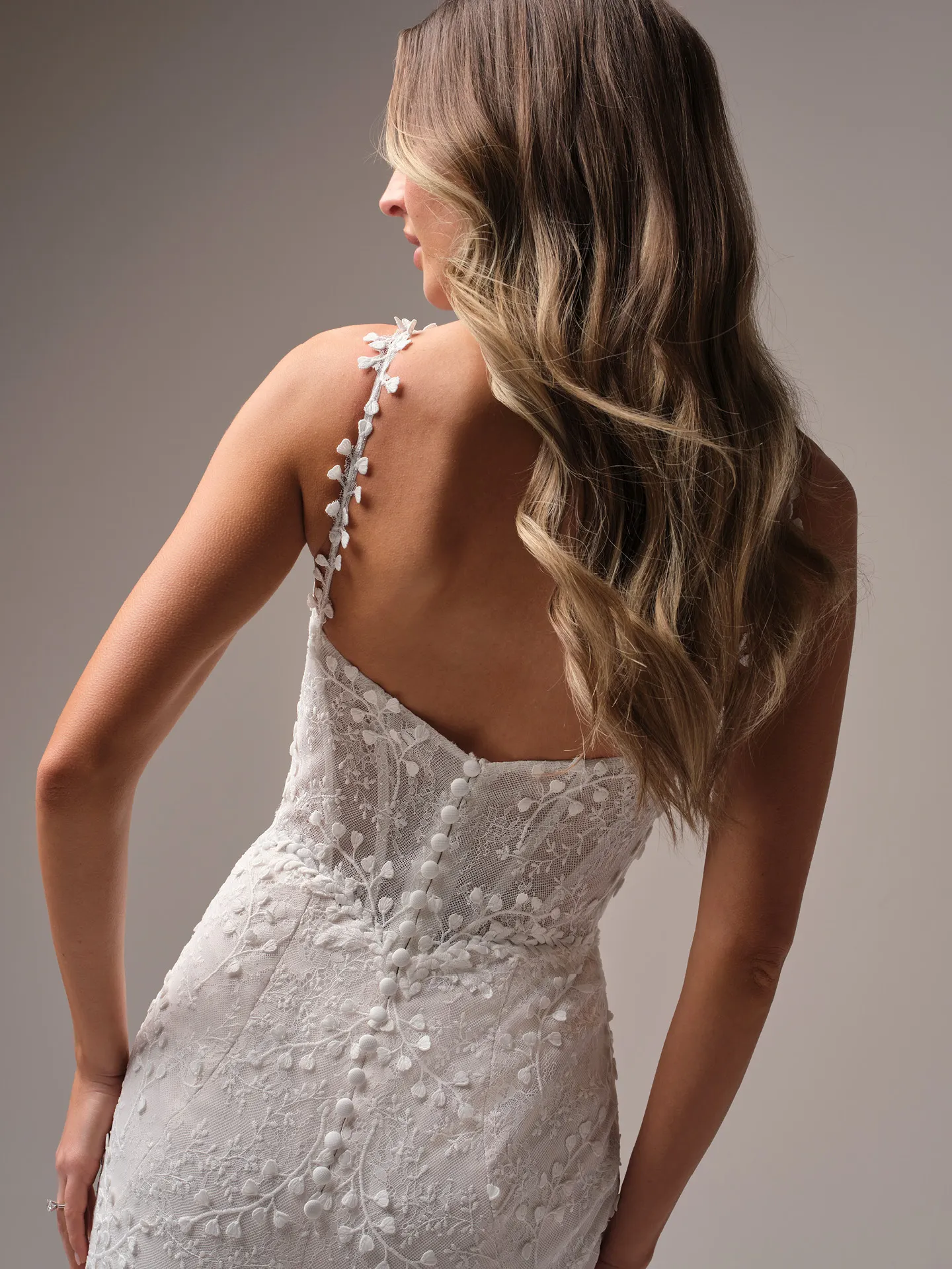 Rebecca Ingram Isabella back view with textured spaghetti strap and lace detailing.