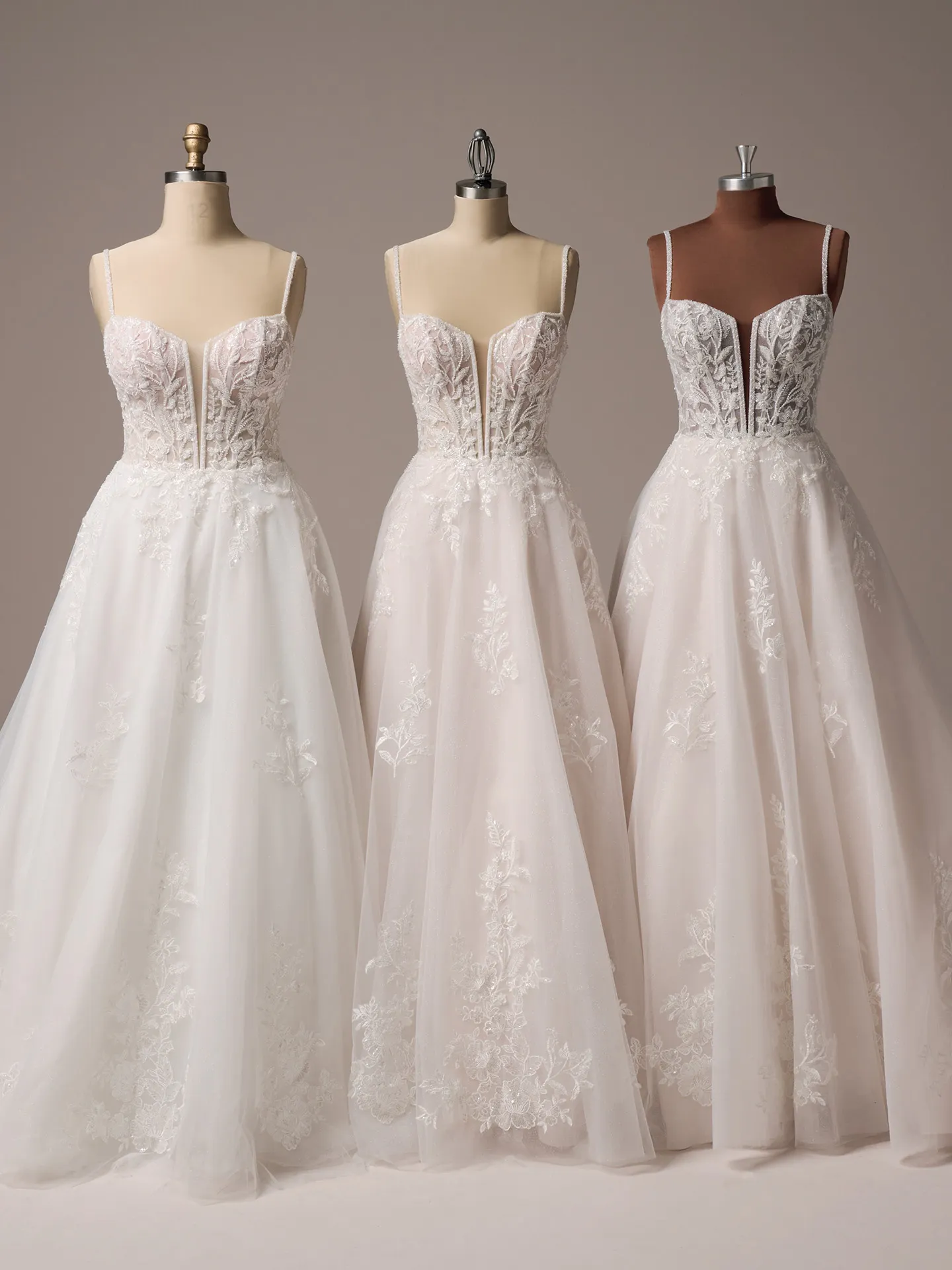 Rebecca Ingram Jude front view lace A-line wedding gowns on mannequins.