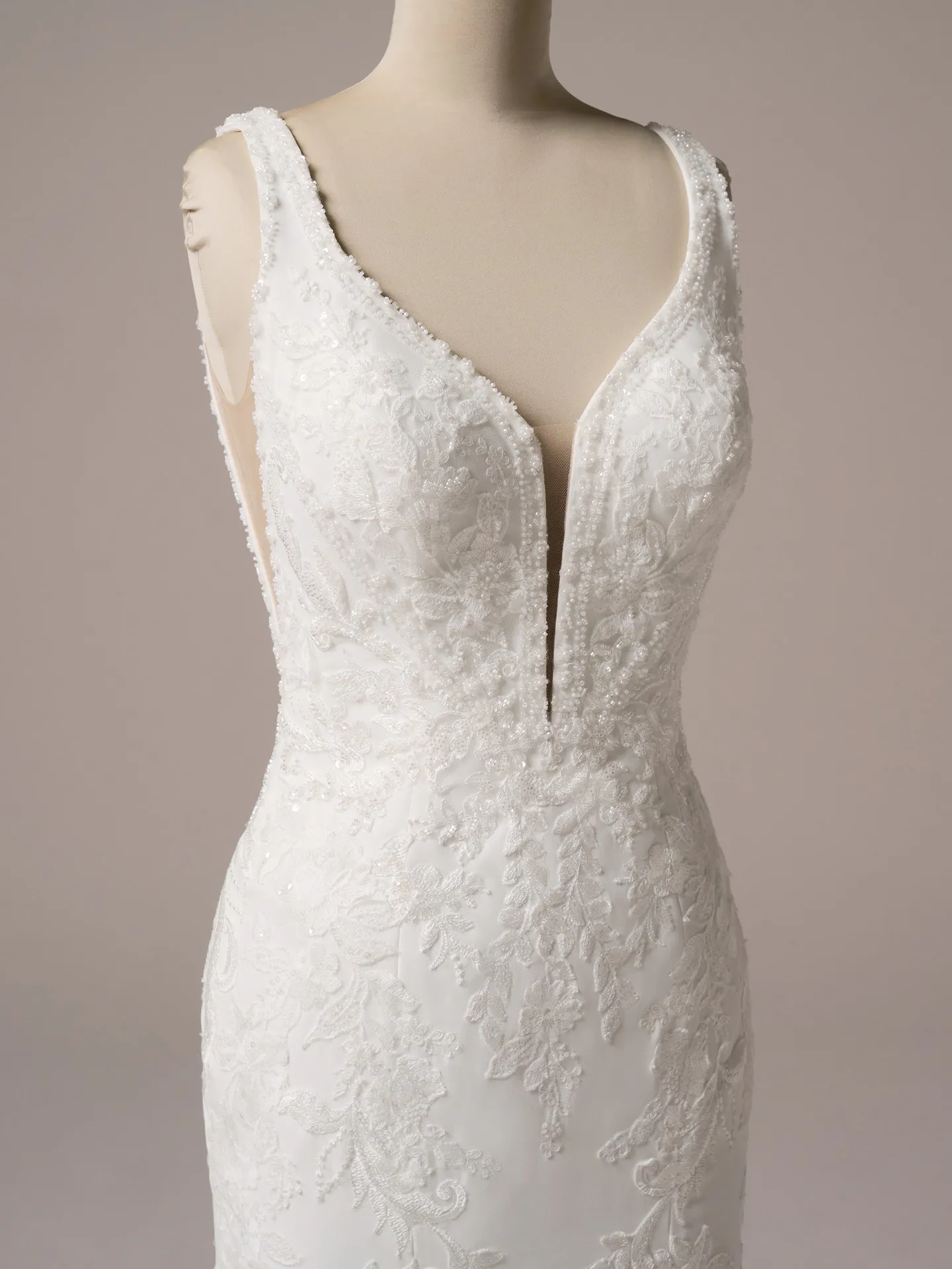 Rebecca Ingram Larissa front view deep-V fit-and-flare gown with lace details