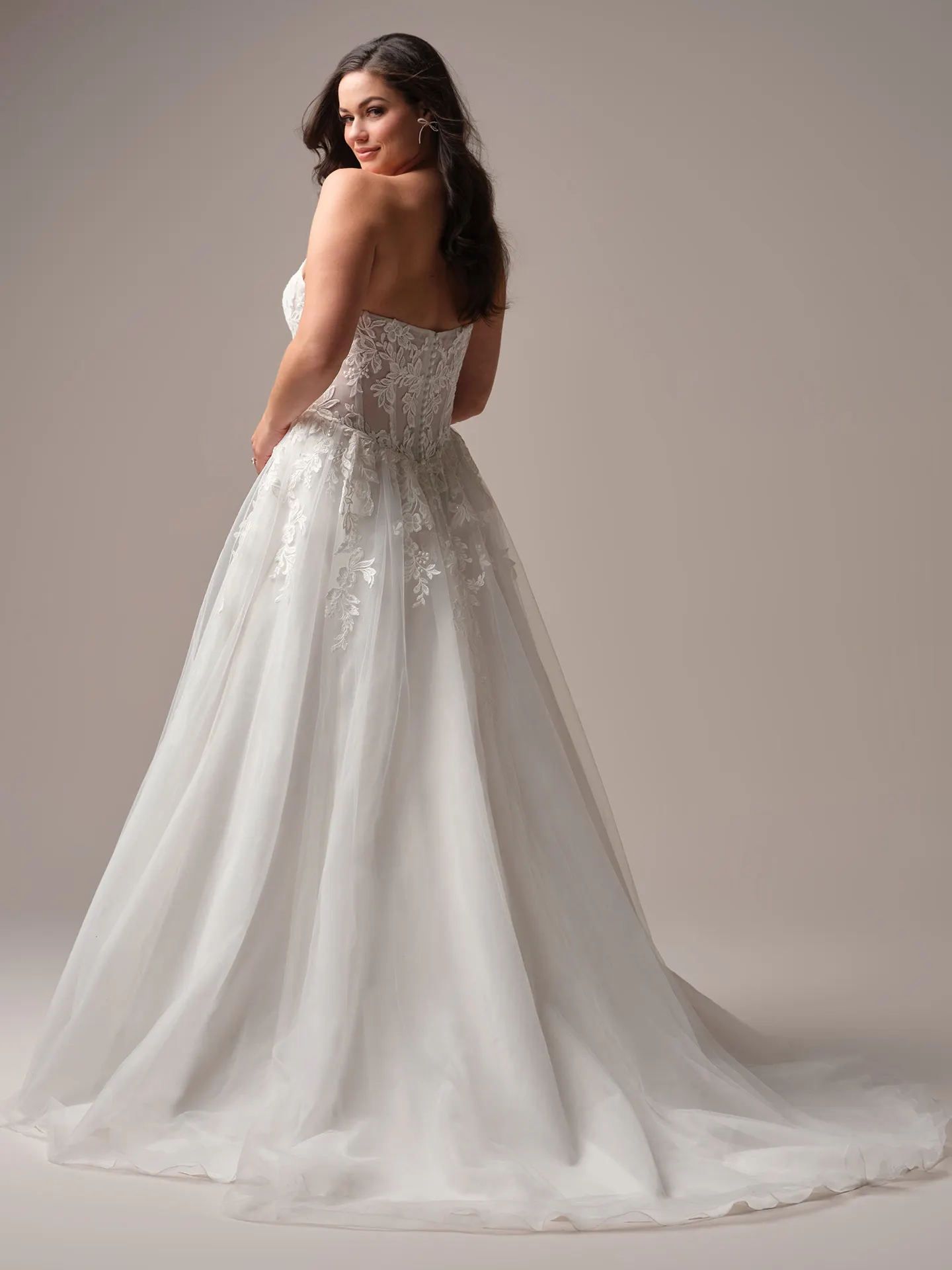 Rebecca Ingram Paige back view A-line wedding dress with lace details.