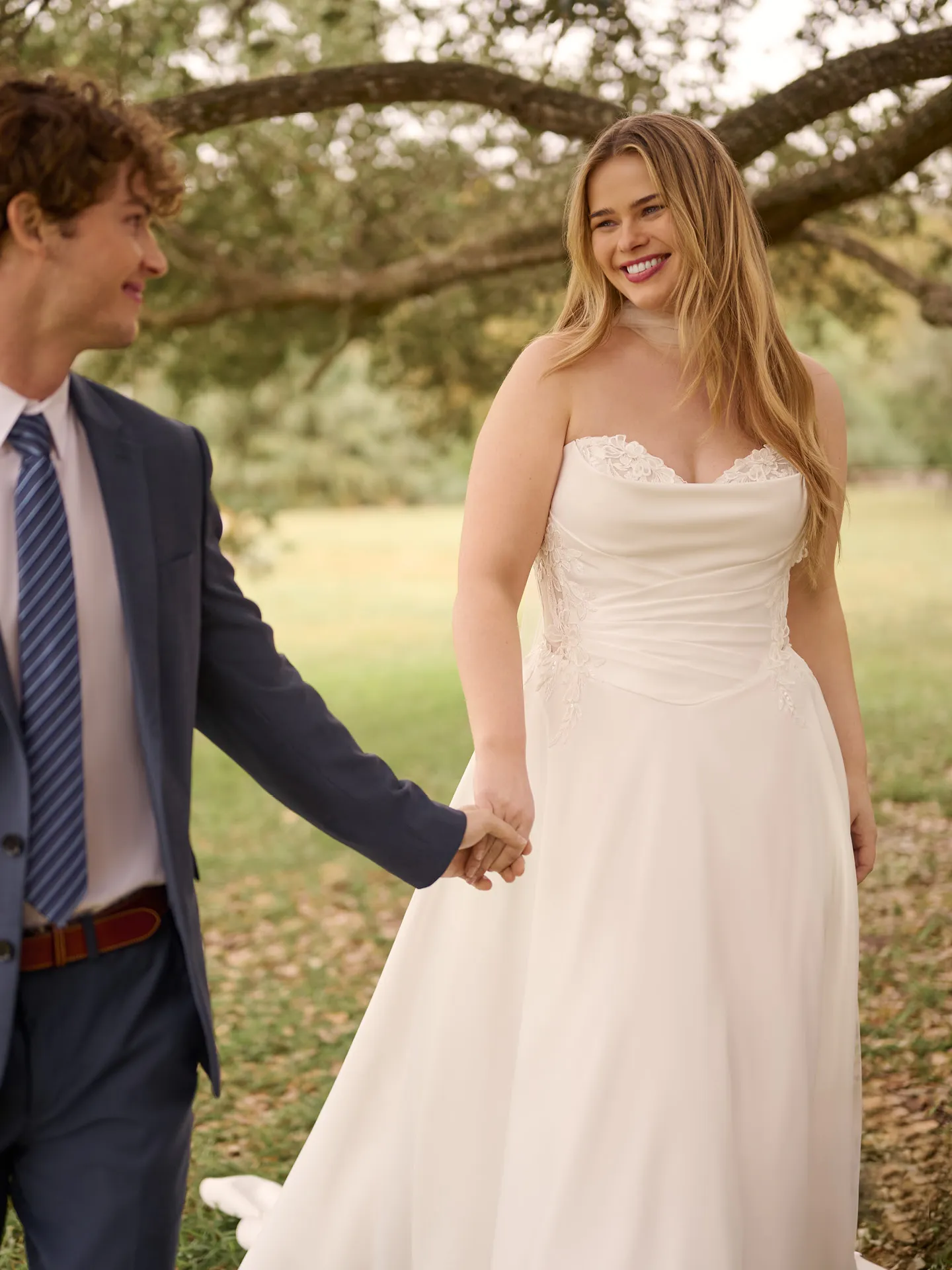 Rebecca Ingram Sable front view sweetheart A-line gown in outdoor setting