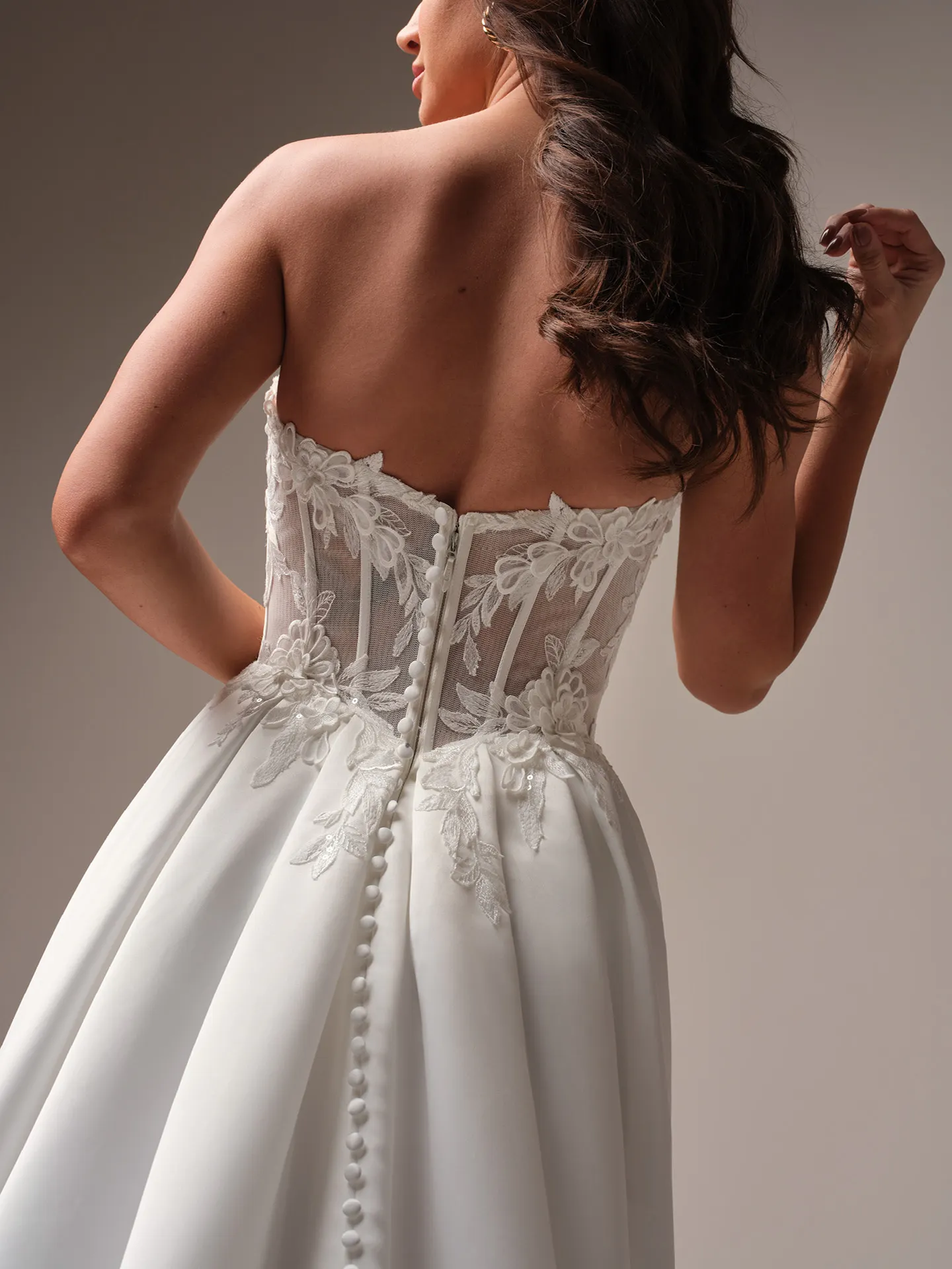 Rebecca Ingram Sable back view floral lace A-line gown with buttons