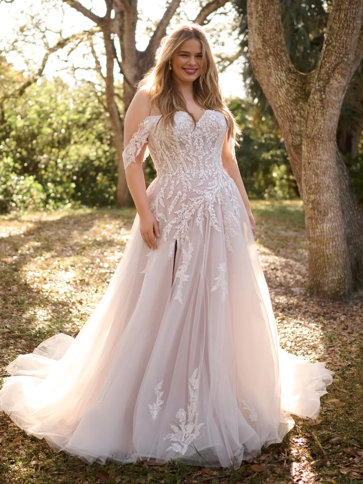 Rebecca Ingram Victoria front view floral A-line bridal gown in outdoor setting