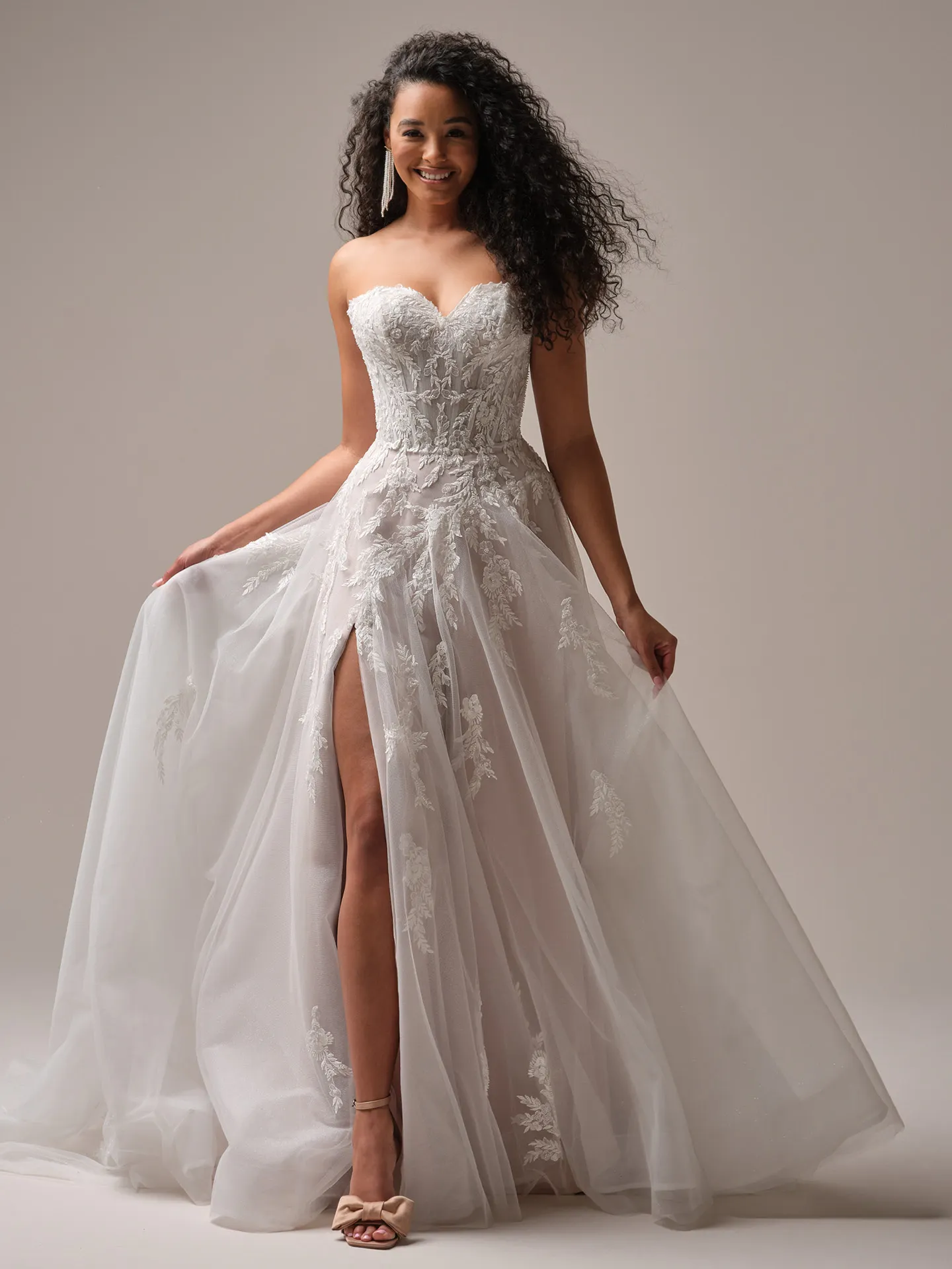 Rebecca Ingram Victoria floral A-line gown front view with slit and sparkle detailing.