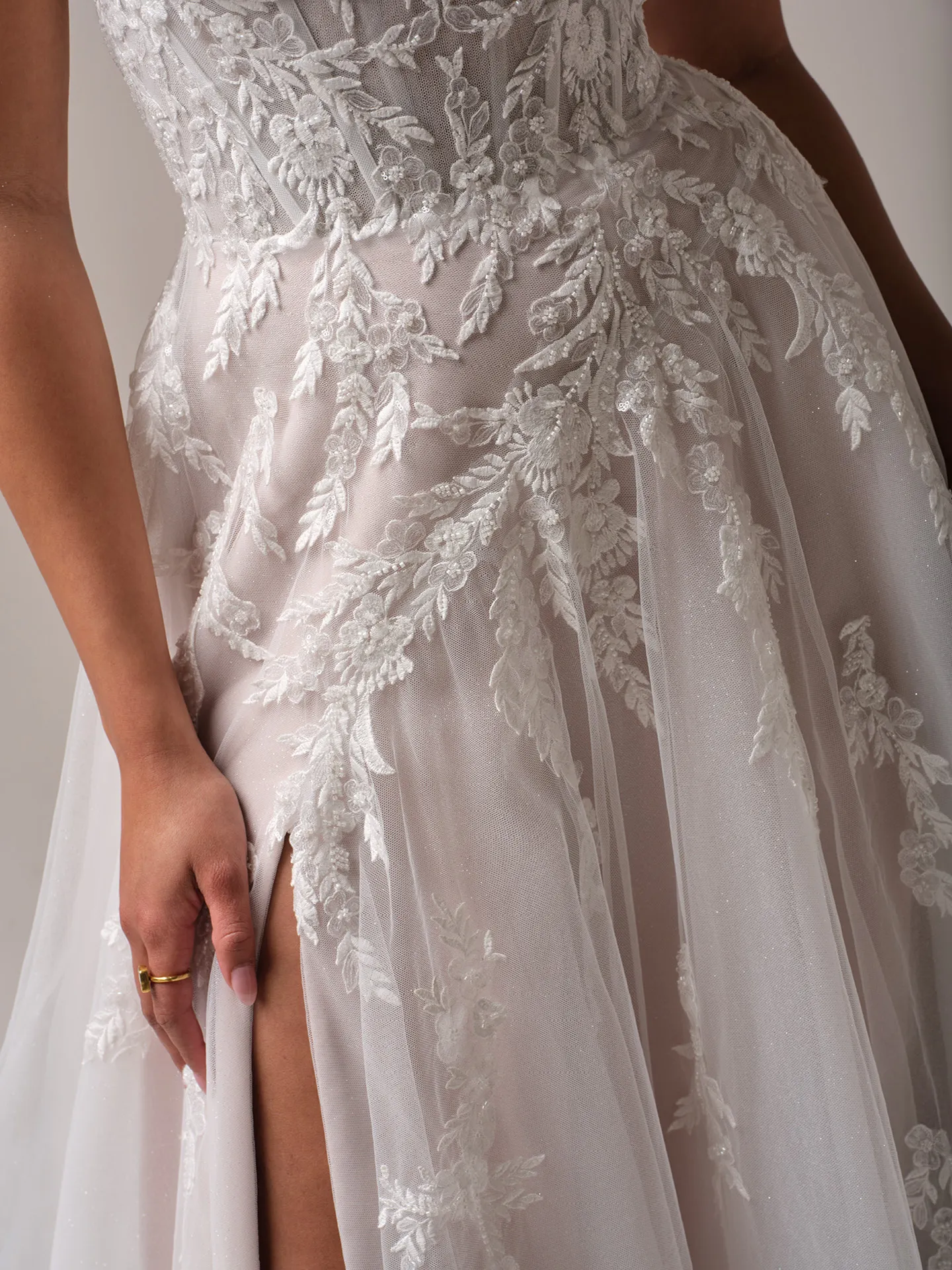 Rebecca Ingram Victoria floral A-line gown with slit, close-up view.
