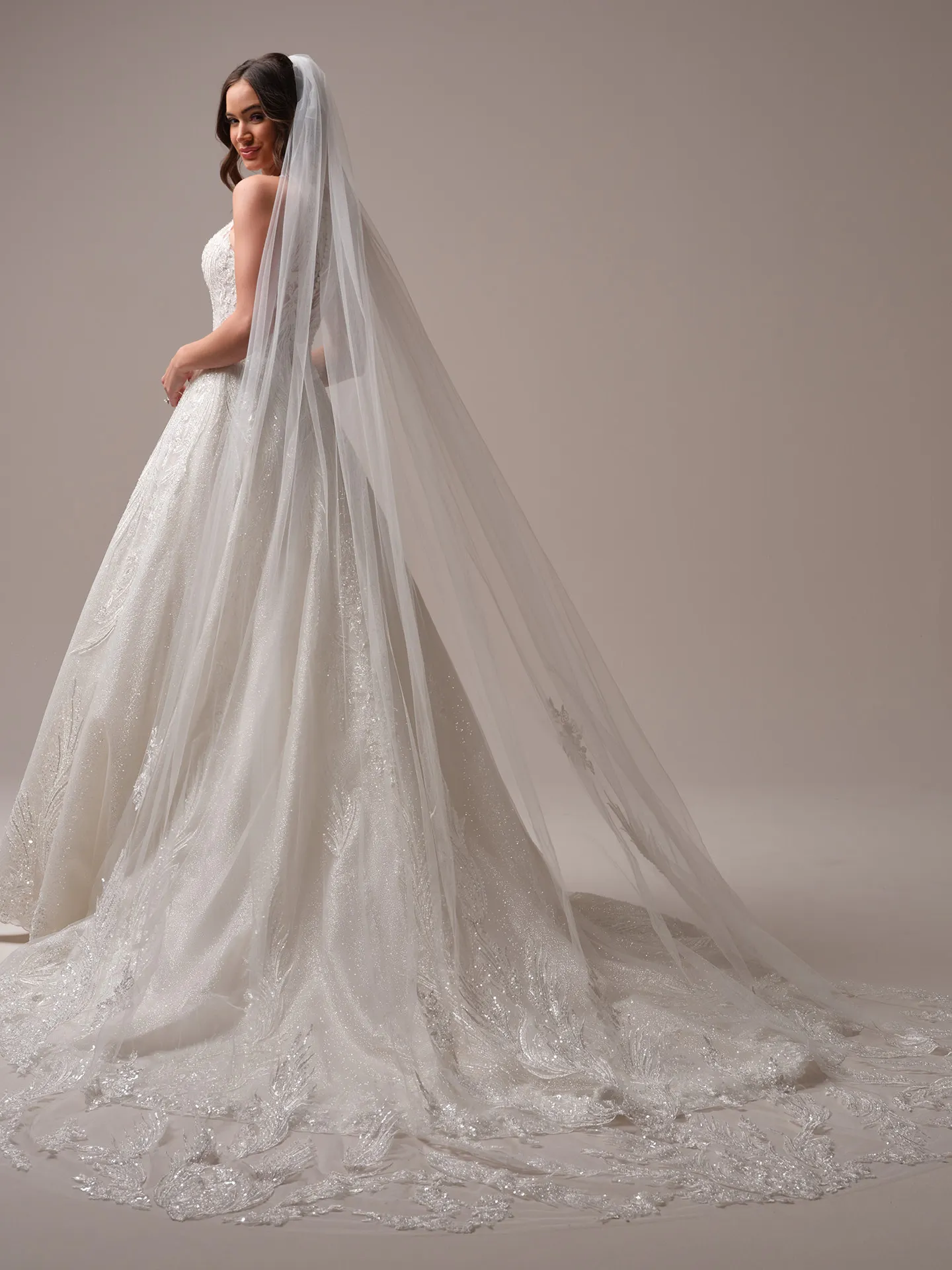Sottero and Midgley Genevieve ballgown wedding dress back angle with flowing train