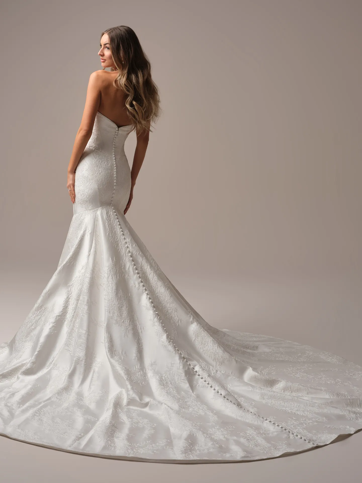Sottero and Midgley Giselle Marie fit and flare wedding dress back view with longer lace train