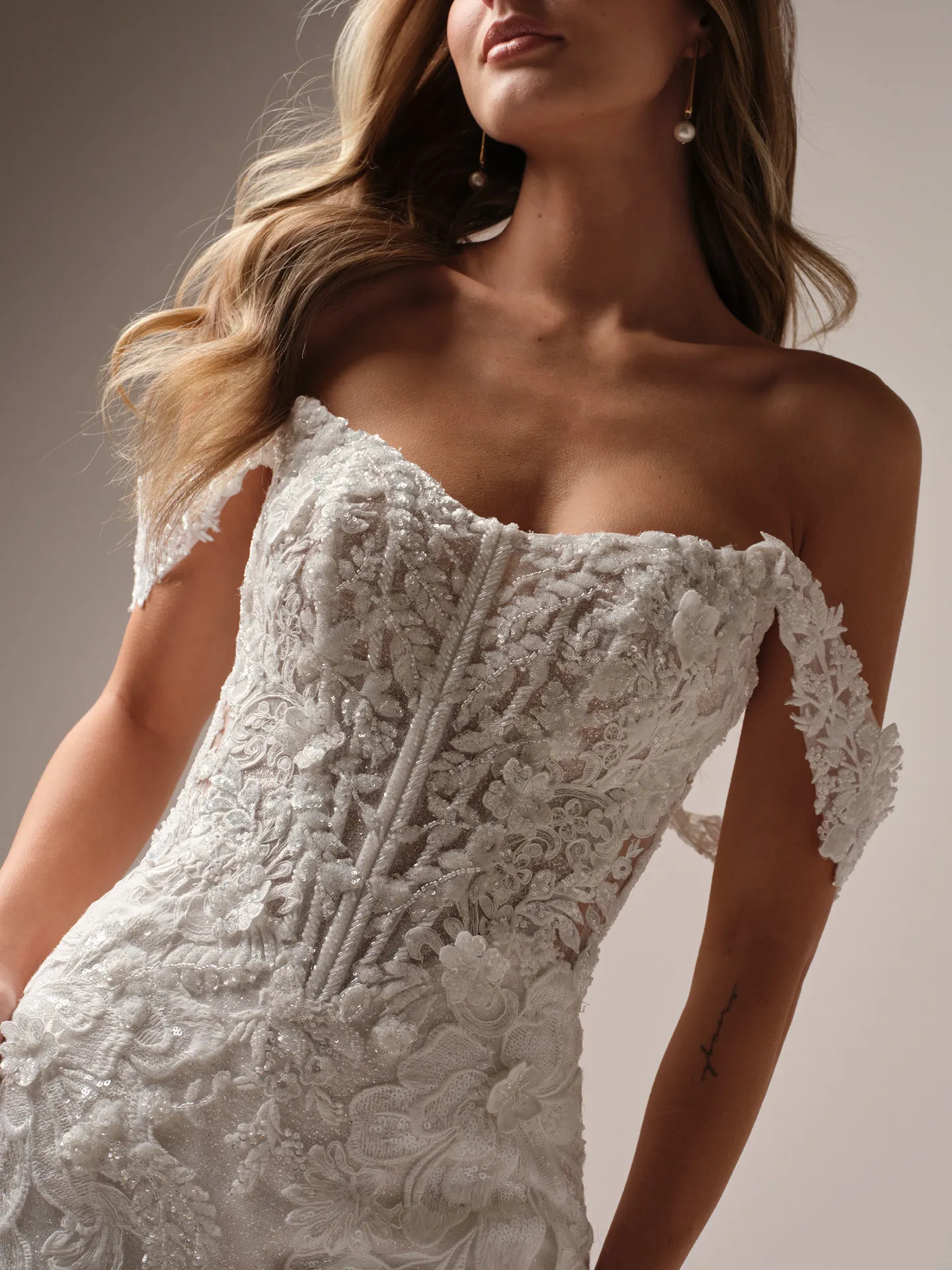 Sottero and Midgley Halle fit and flare wedding dress back view with lace train extending behind