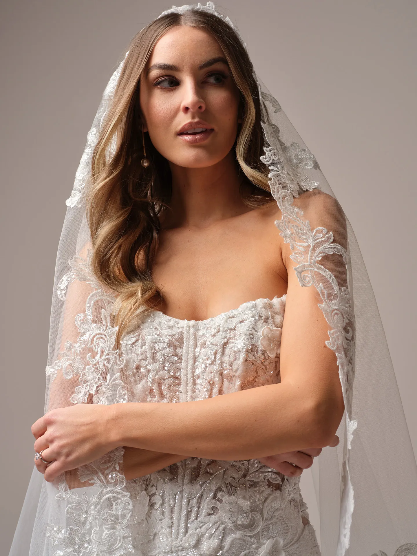 Sottero and Midgley Halle fit and flare wedding dress side view with skirt tapering at knees