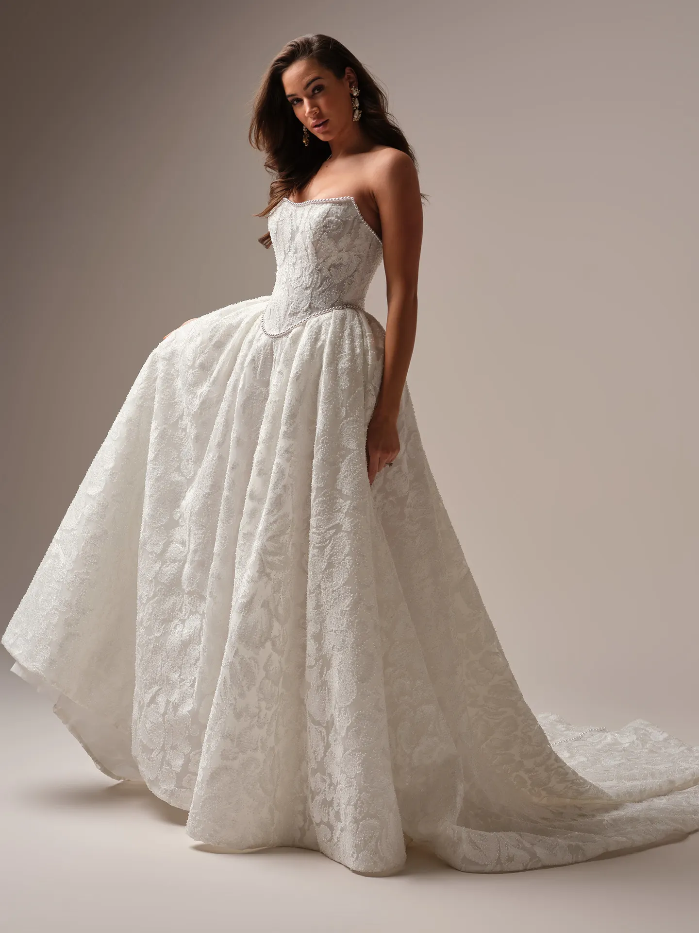 Sottero and Midgley January ballgown wedding dress side angle with layered skirt volume