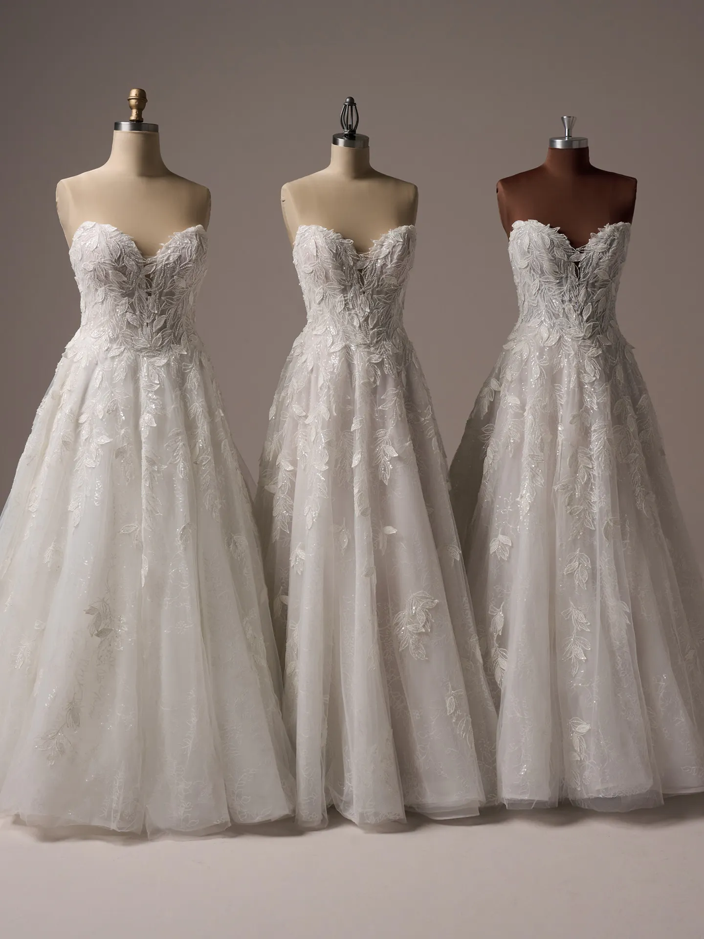 Sottero and Midgley Maritza 3-D floral A-line wedding gowns on mannequins front view