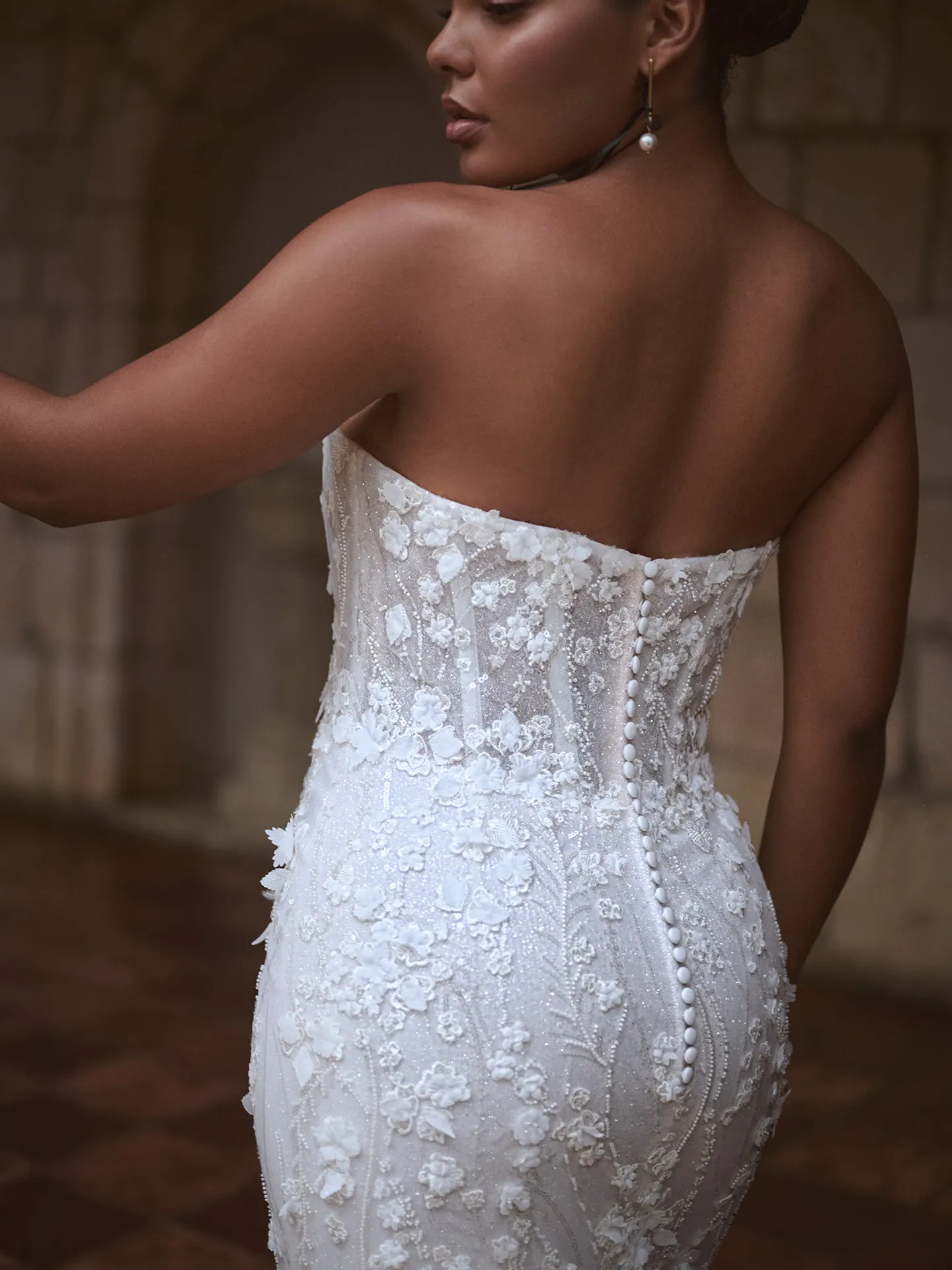 Noor back view floral lace mermaid wedding dress by Sottero and Midgley.