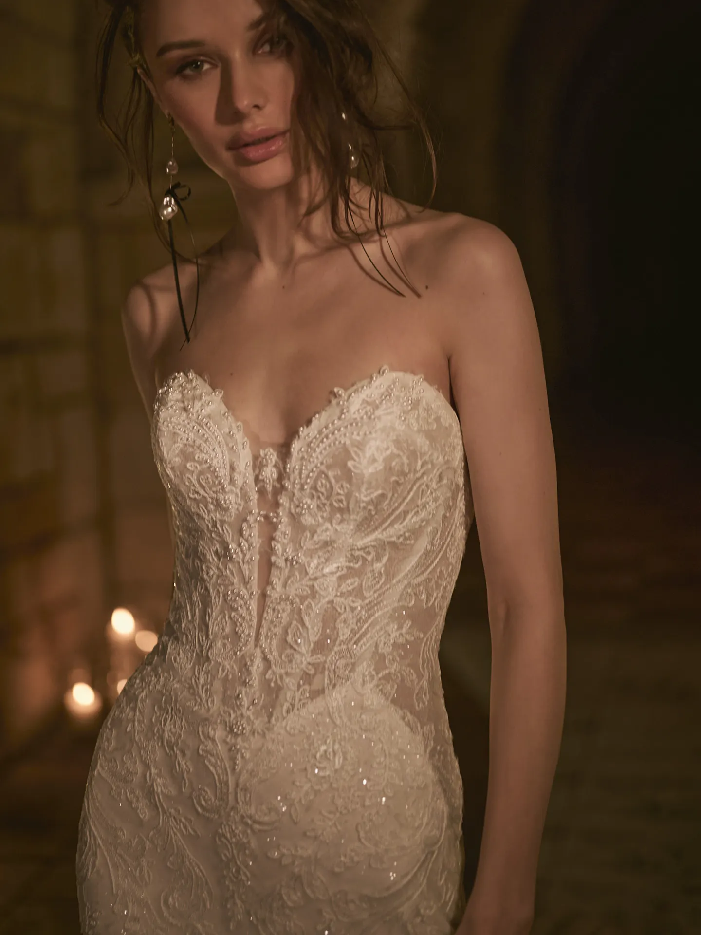 Zareen illusion lace mermaid dress front view candles backdrop.
