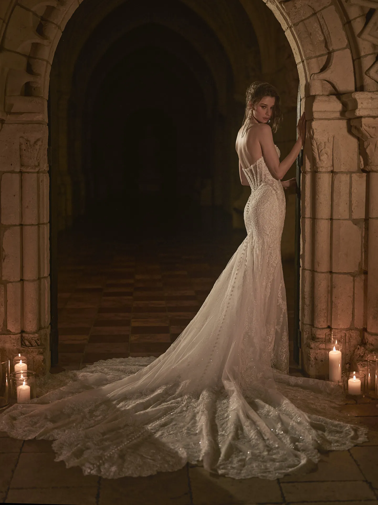 Sottero and Midgley Zareen back view mermaid dress with lace, scalloped train, lit candles